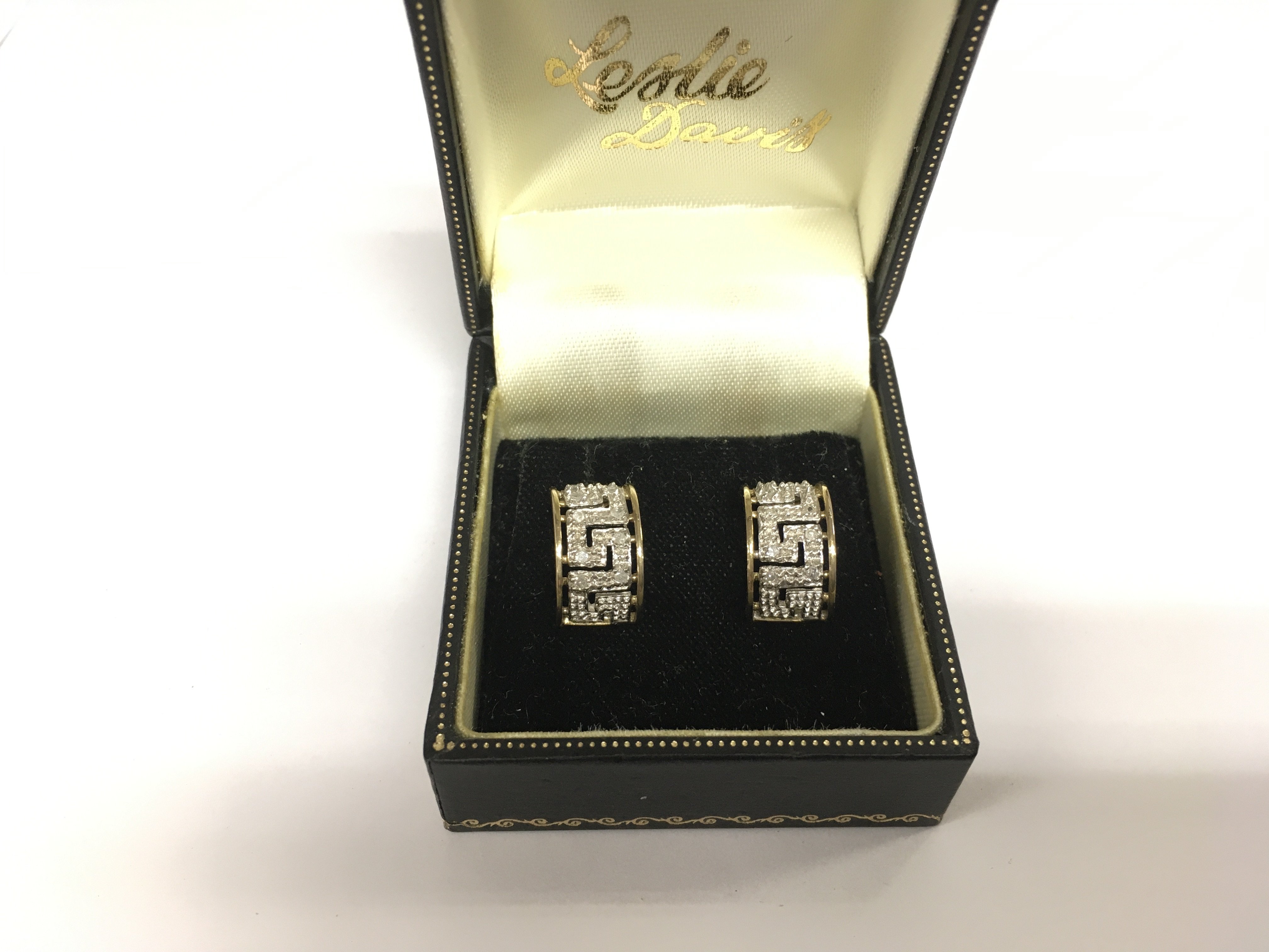 A pair of 9k gold and diamond earrings in Greek key pattern, approx 2.9g. Shipping category A.