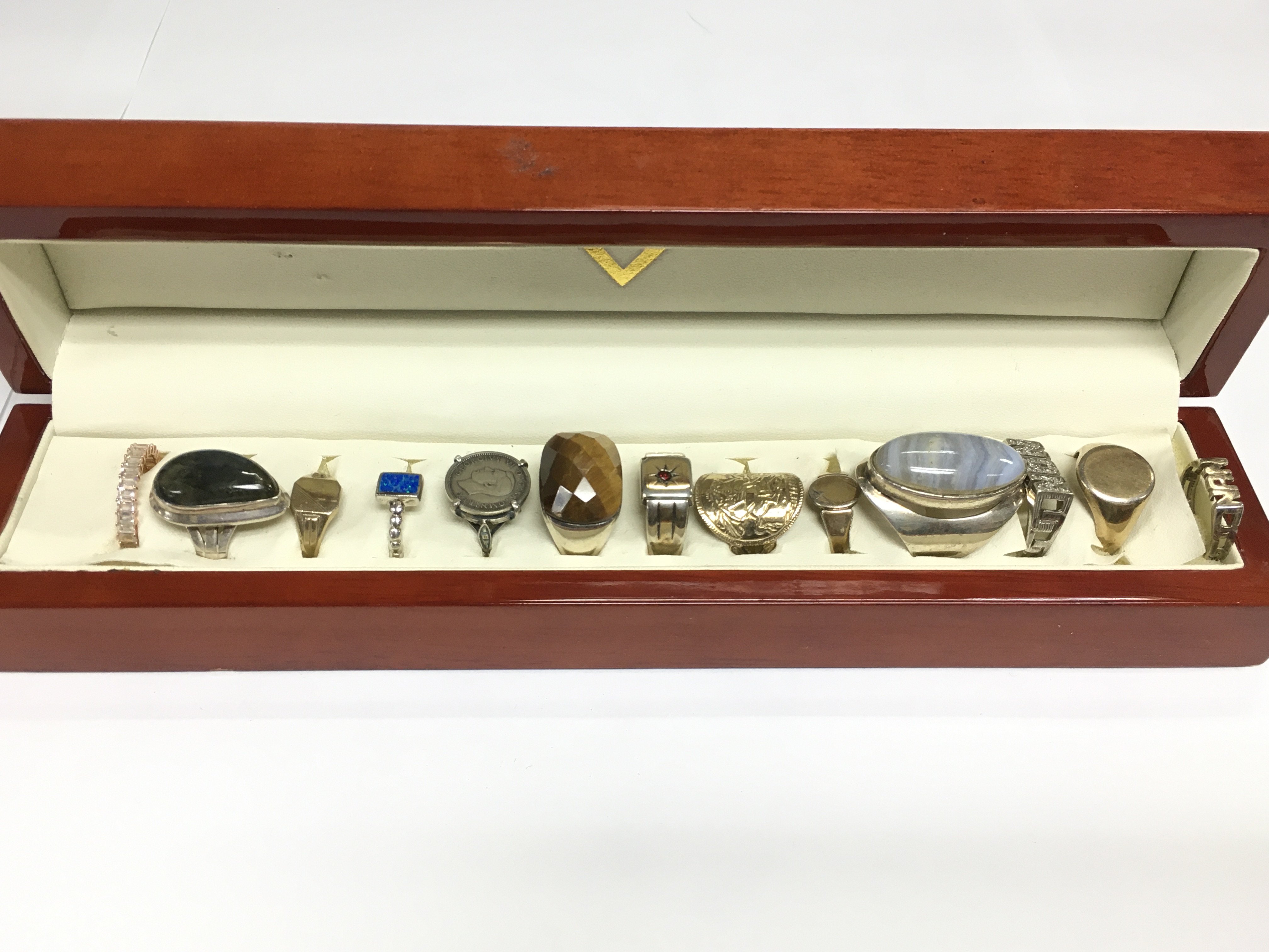 A collection of silver and gold on silver rings. Shipping category A.