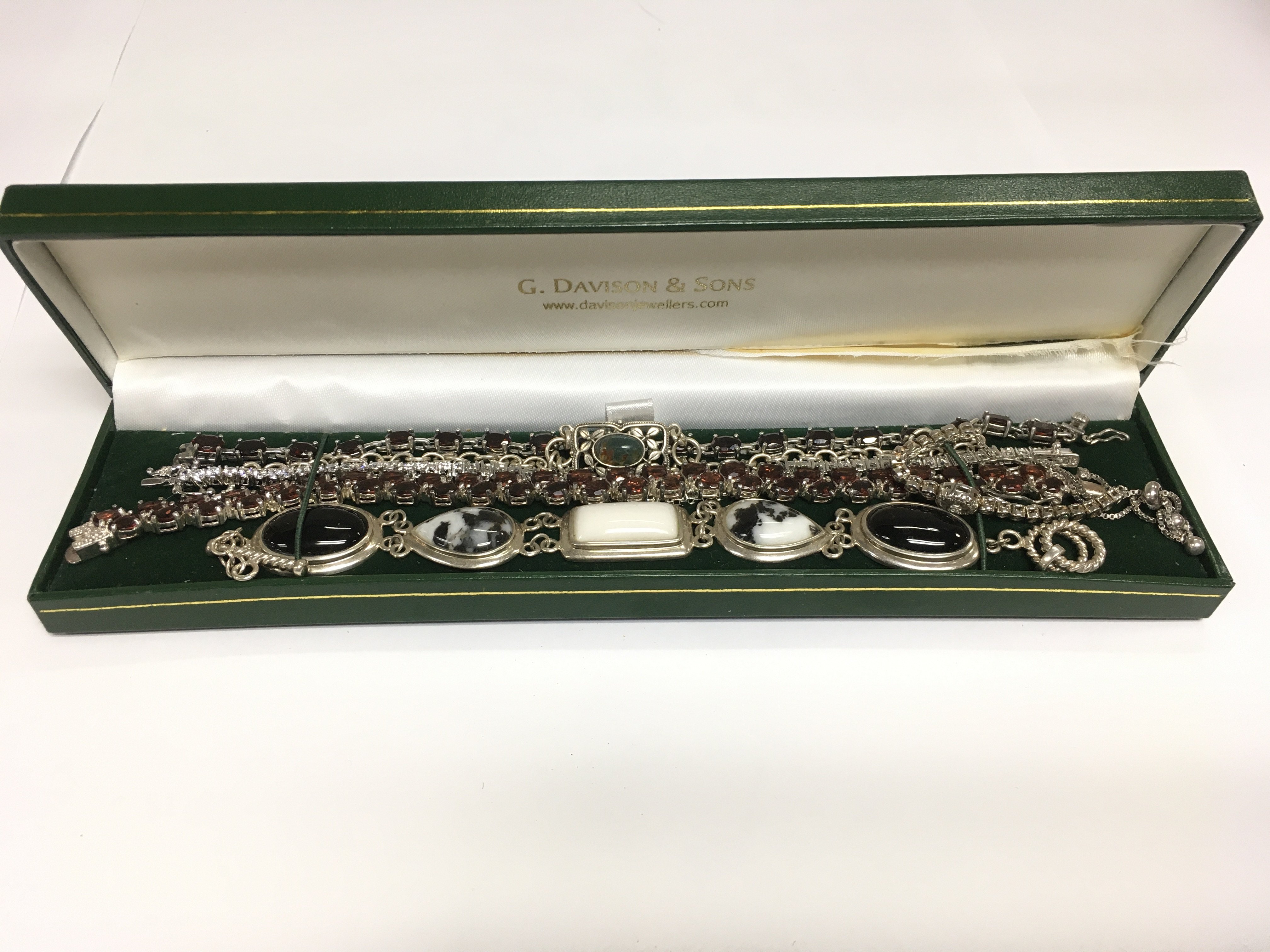 A small collection of modern silver bracelets. Shipping category A.