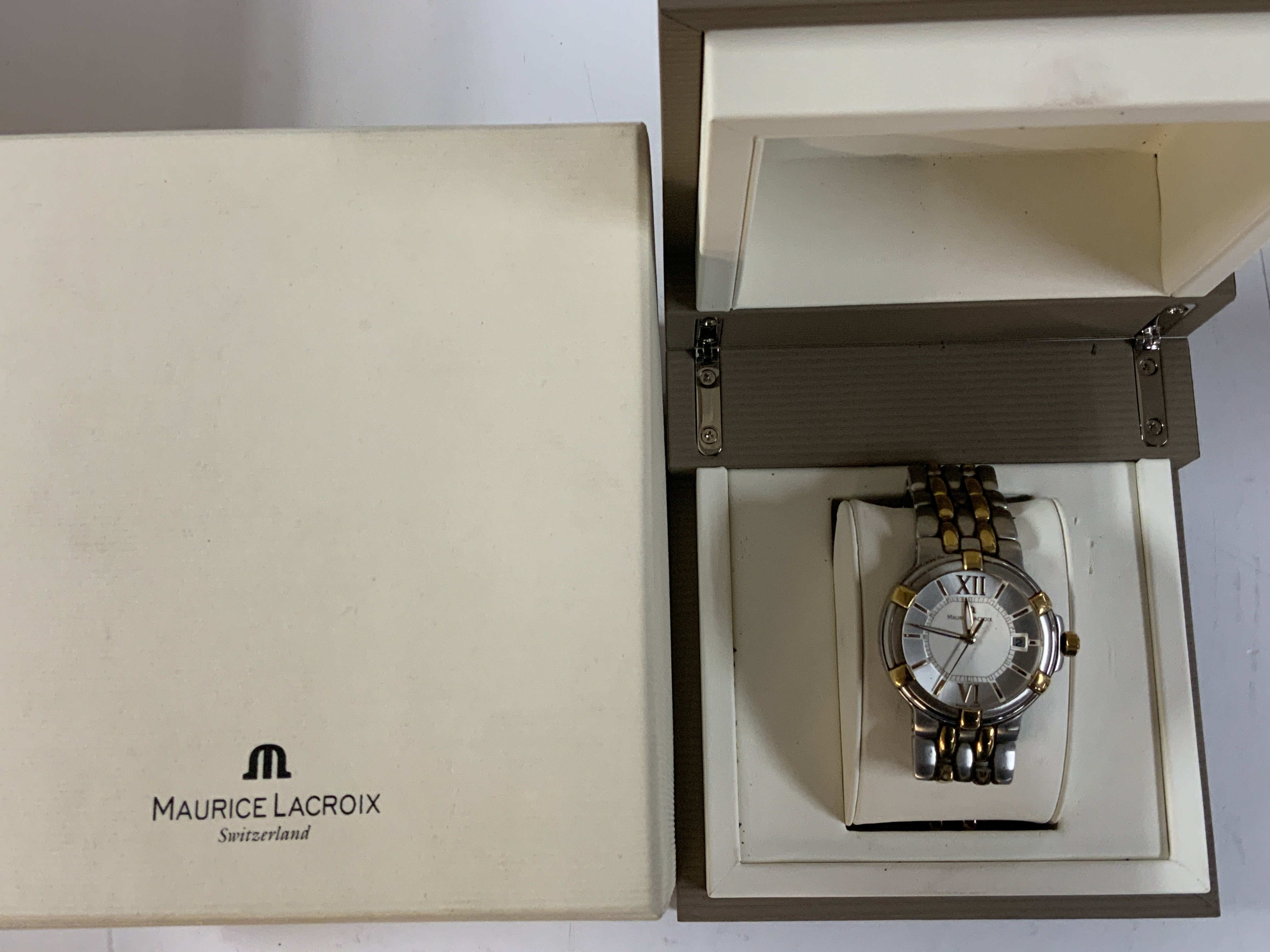 A Maurice Lacroix gents boxed wristwatch, used, strap in need of attention.