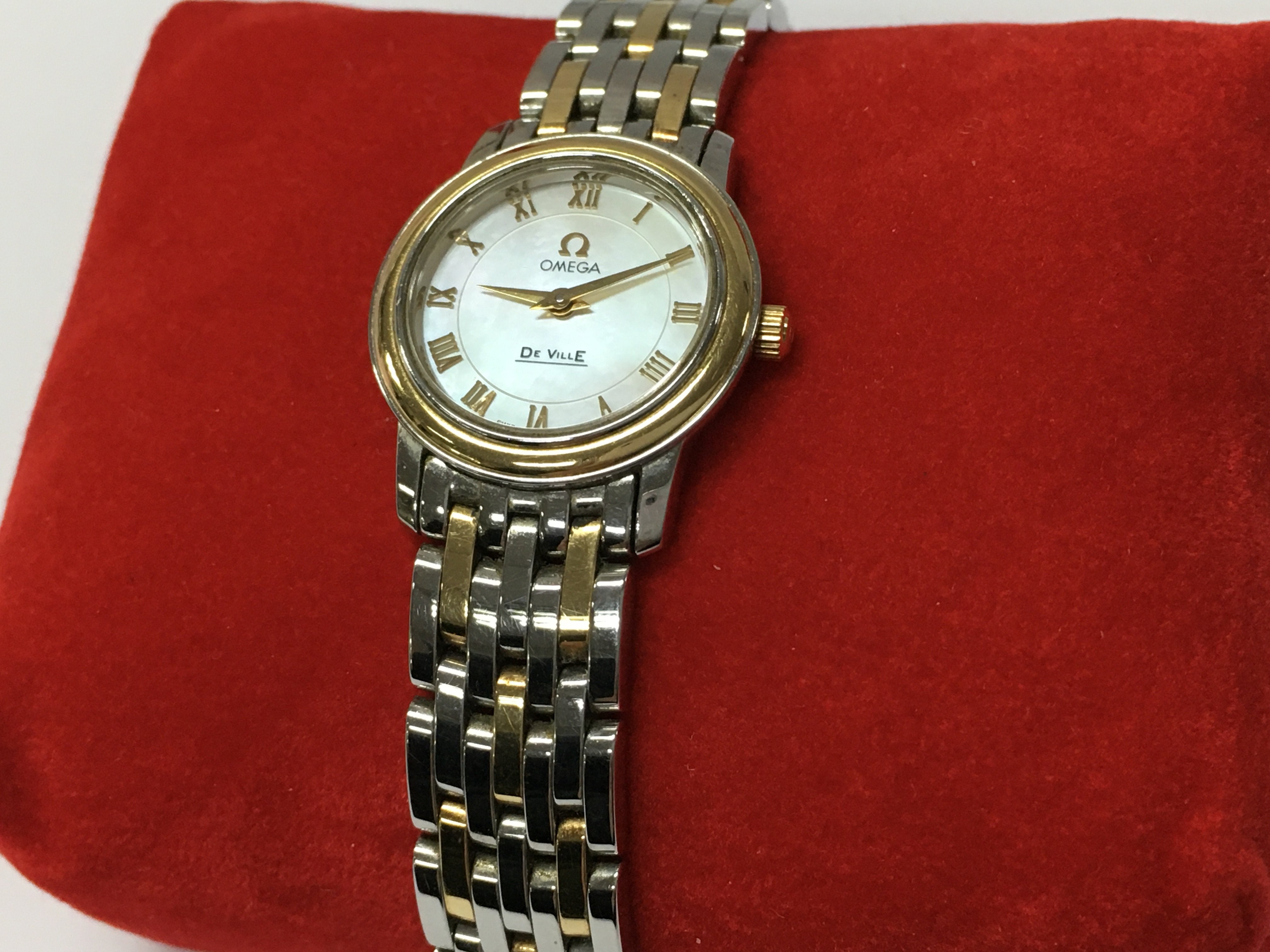 A boxed ladies Omega De Ville Prestige watch with paperwork . Postage category B