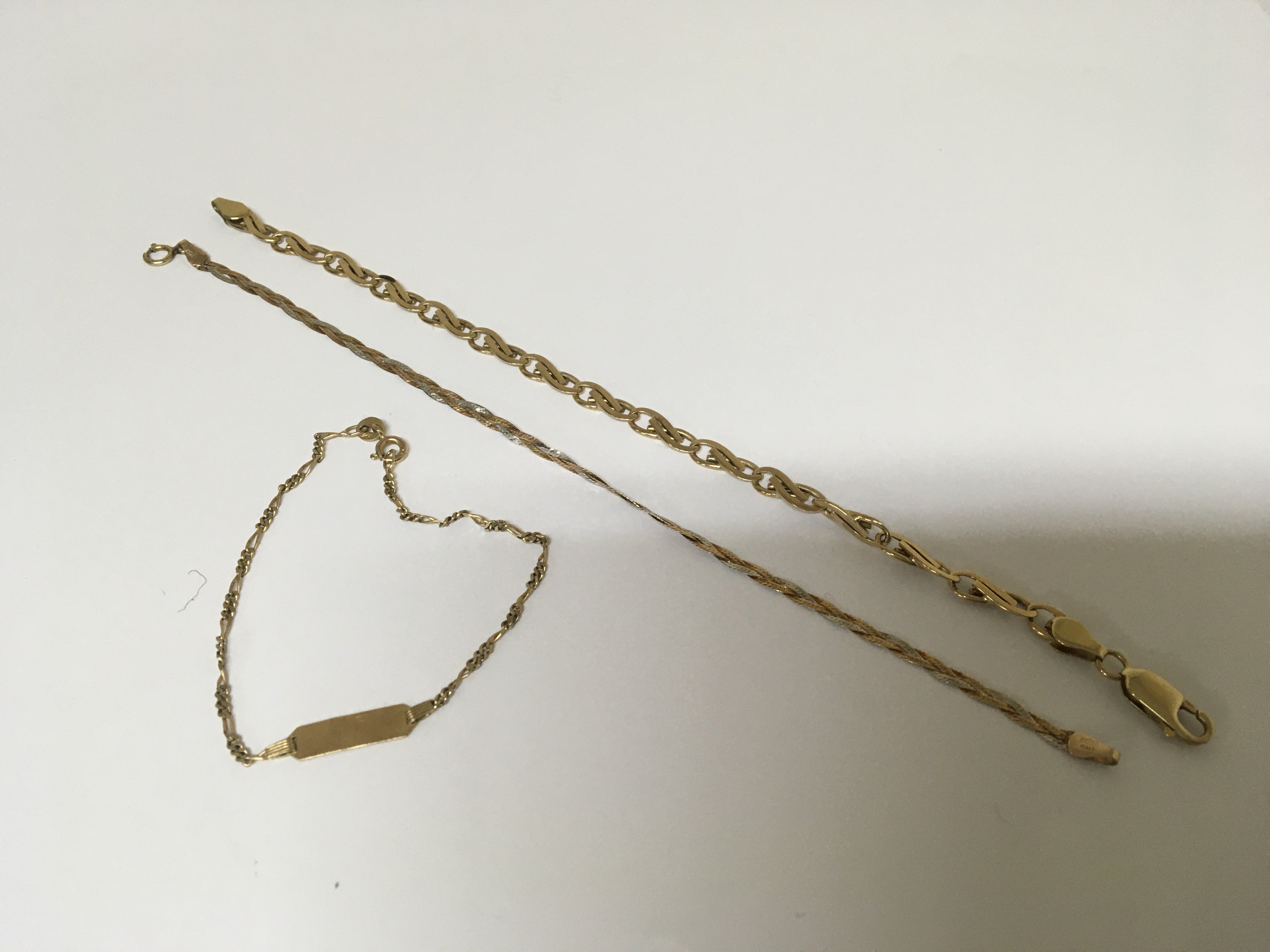 Three 9carat gold bracelets comprising an ID bracelet three colour gold bracelet and one other total weight 9.5g