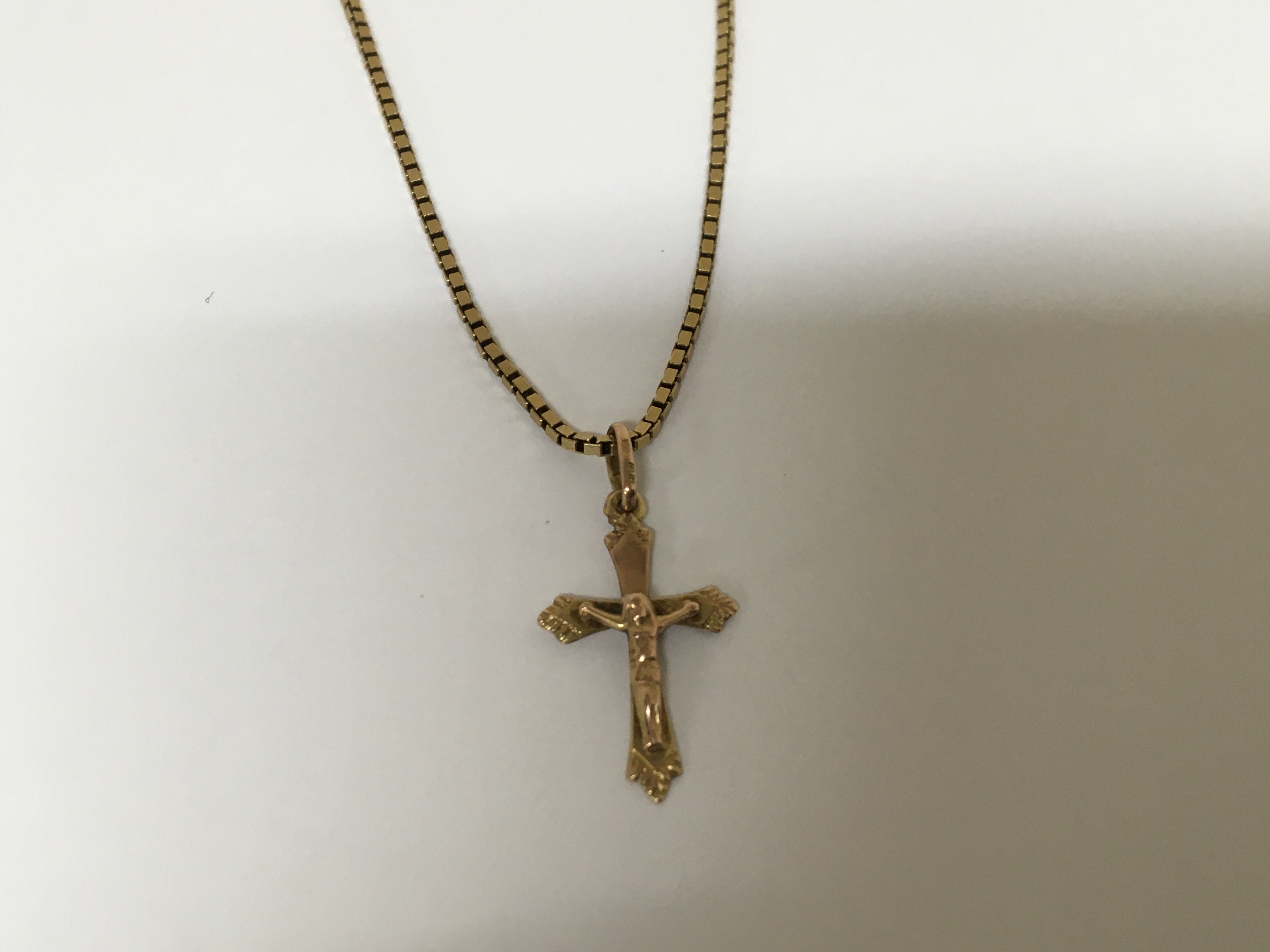 An 18carat gold necklace 7g with a 9carat crucifix pendent attached 1g