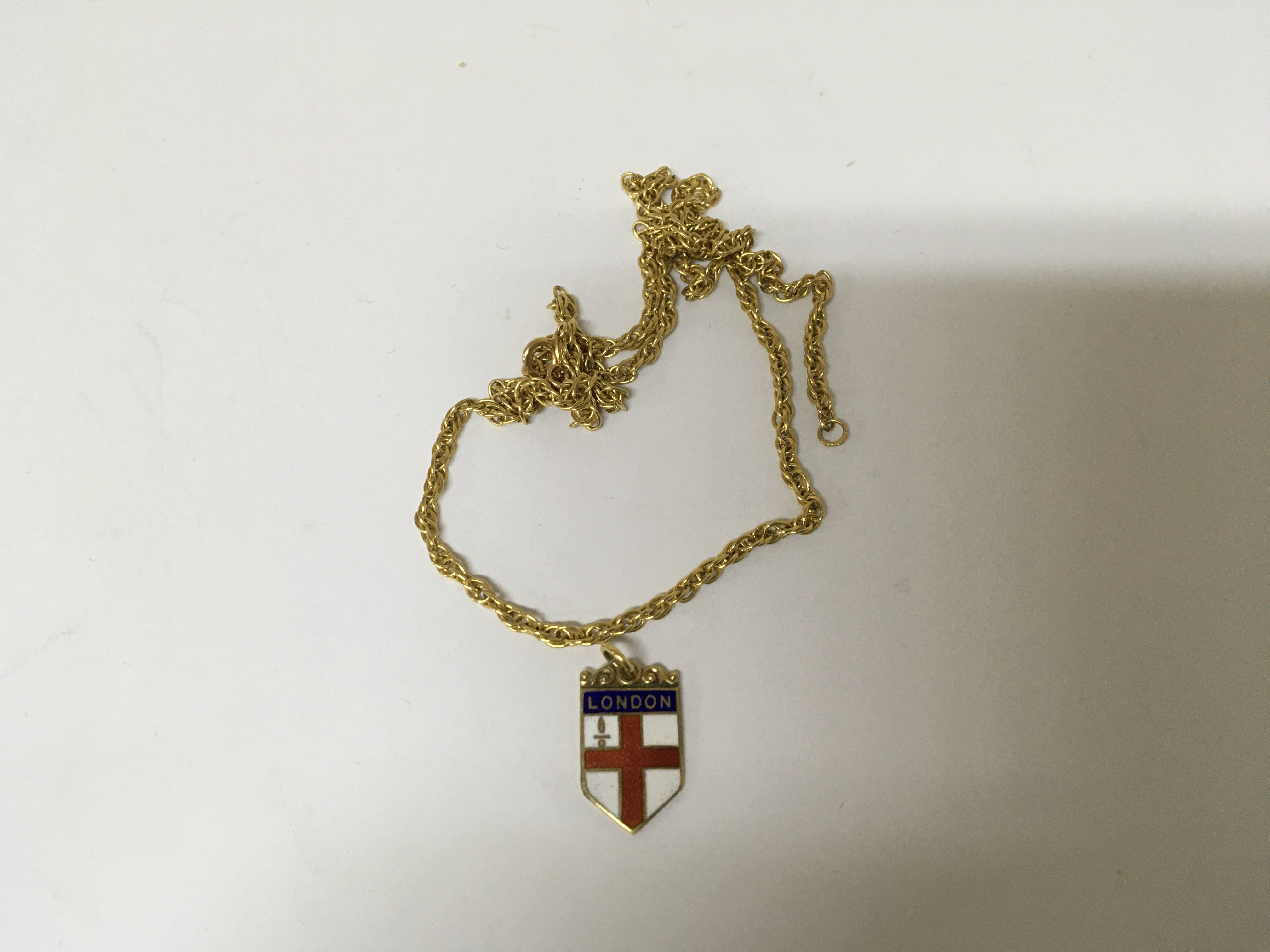 A 9cart necklace with attached enamel 9carat gold London City flag pendent. Total weight 9g