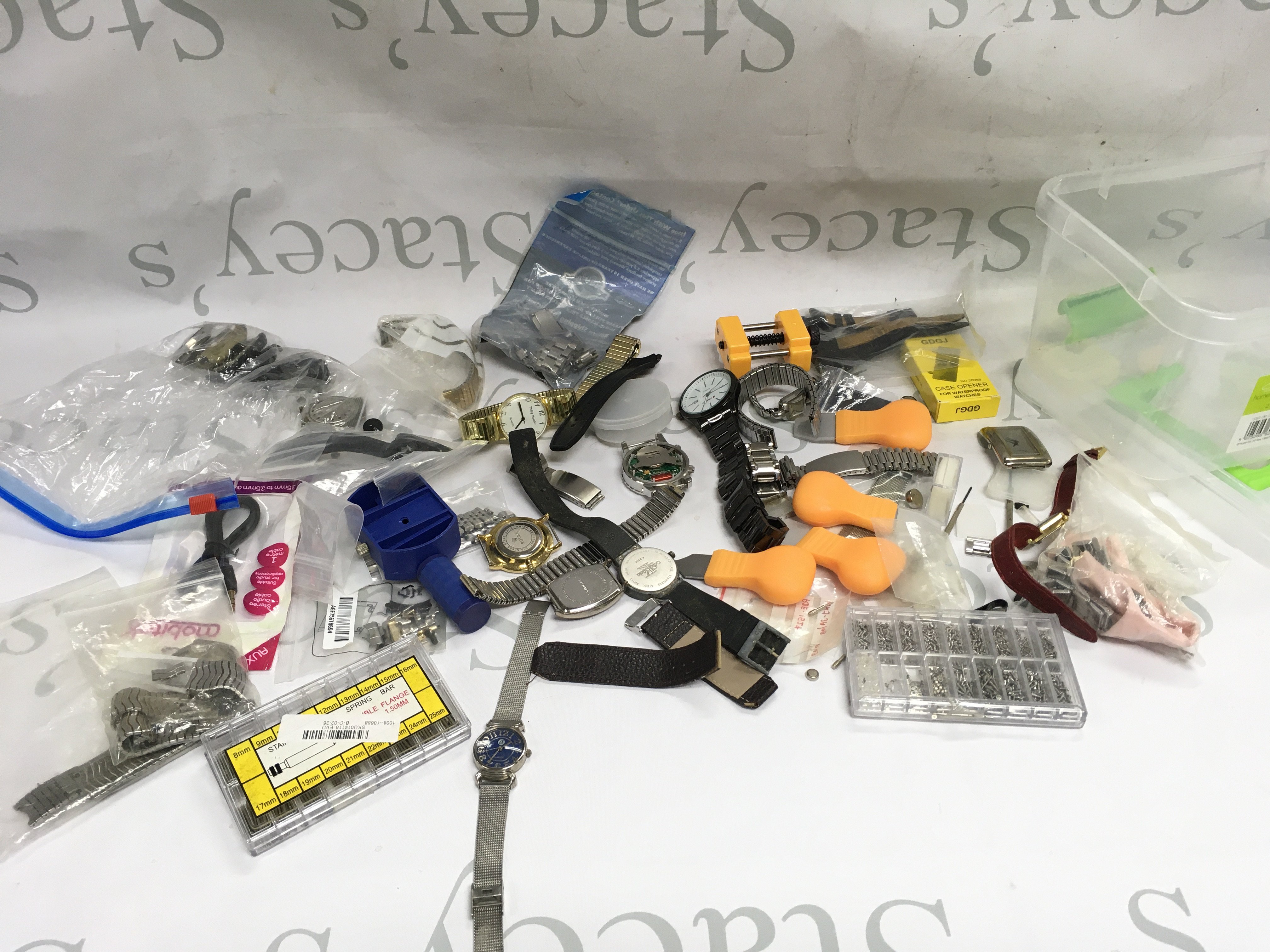 A collection of watch straps watches screws and other accessories Postage B