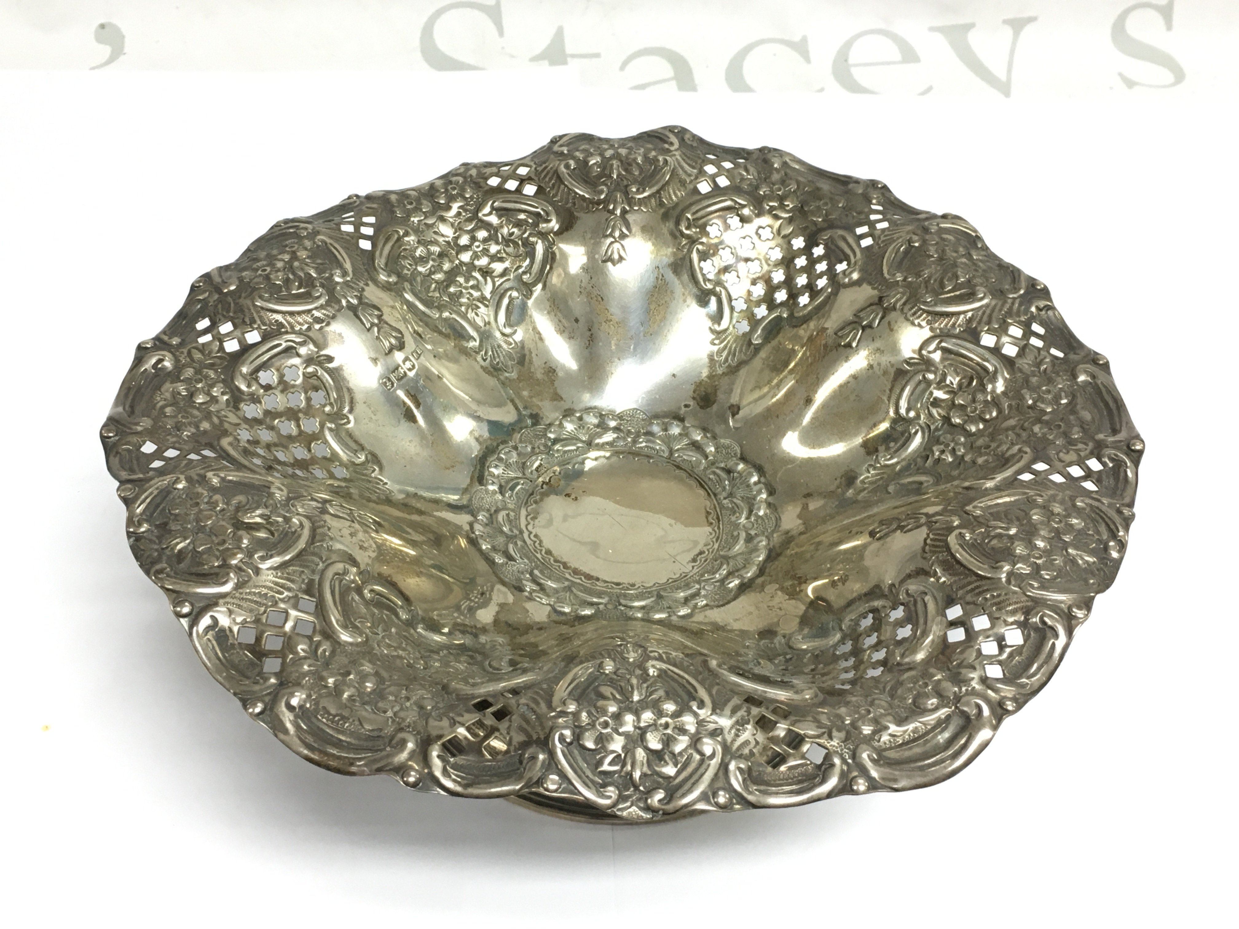A silver fruit bowl with piecework decoration, Sheffield hallmarks, approx 255g. Shipping category B.