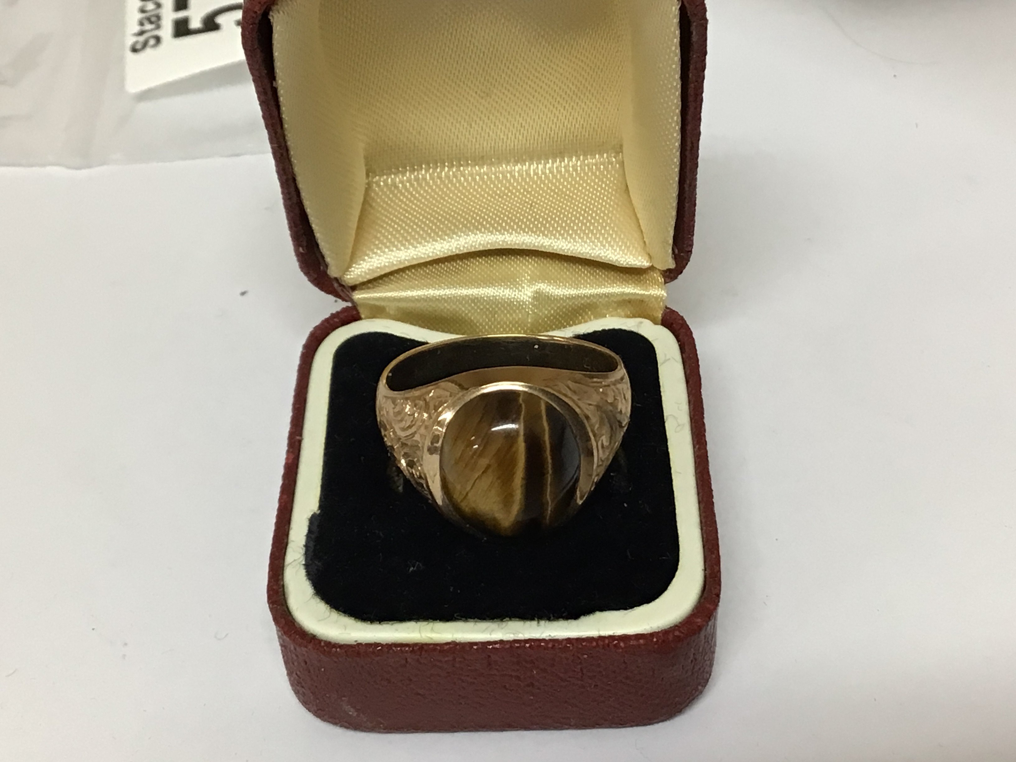 A Gents gold ring set with a Tigers eye stone gold hallmarks worn weight 9g