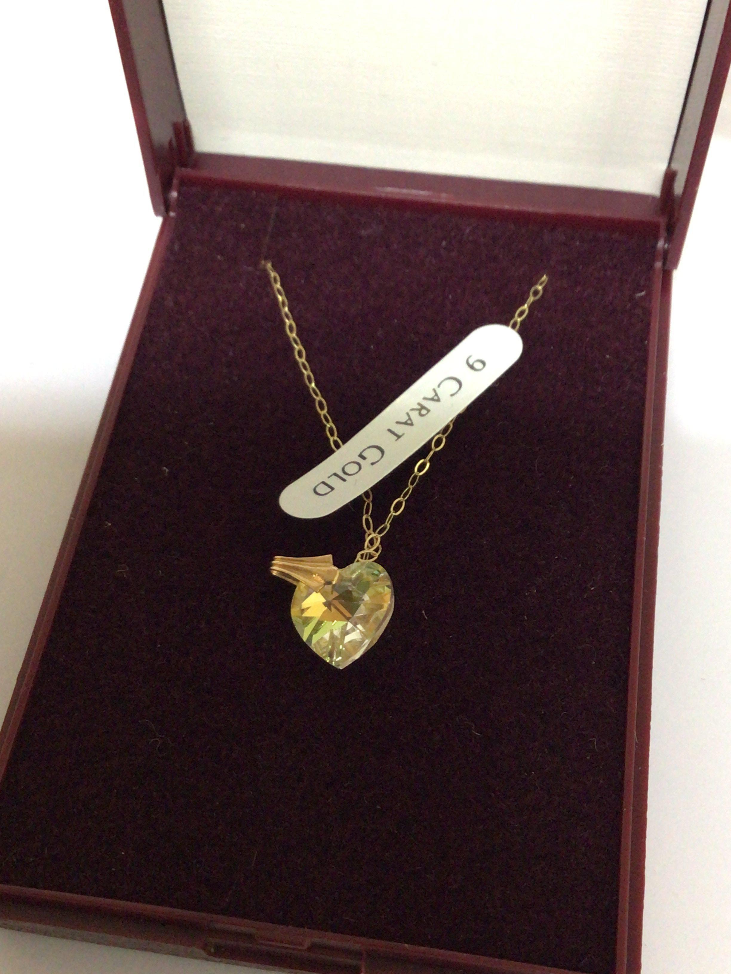 A 9carat gold and Crystal necklace in the form of a heart Elizabeth Duke jewellery.