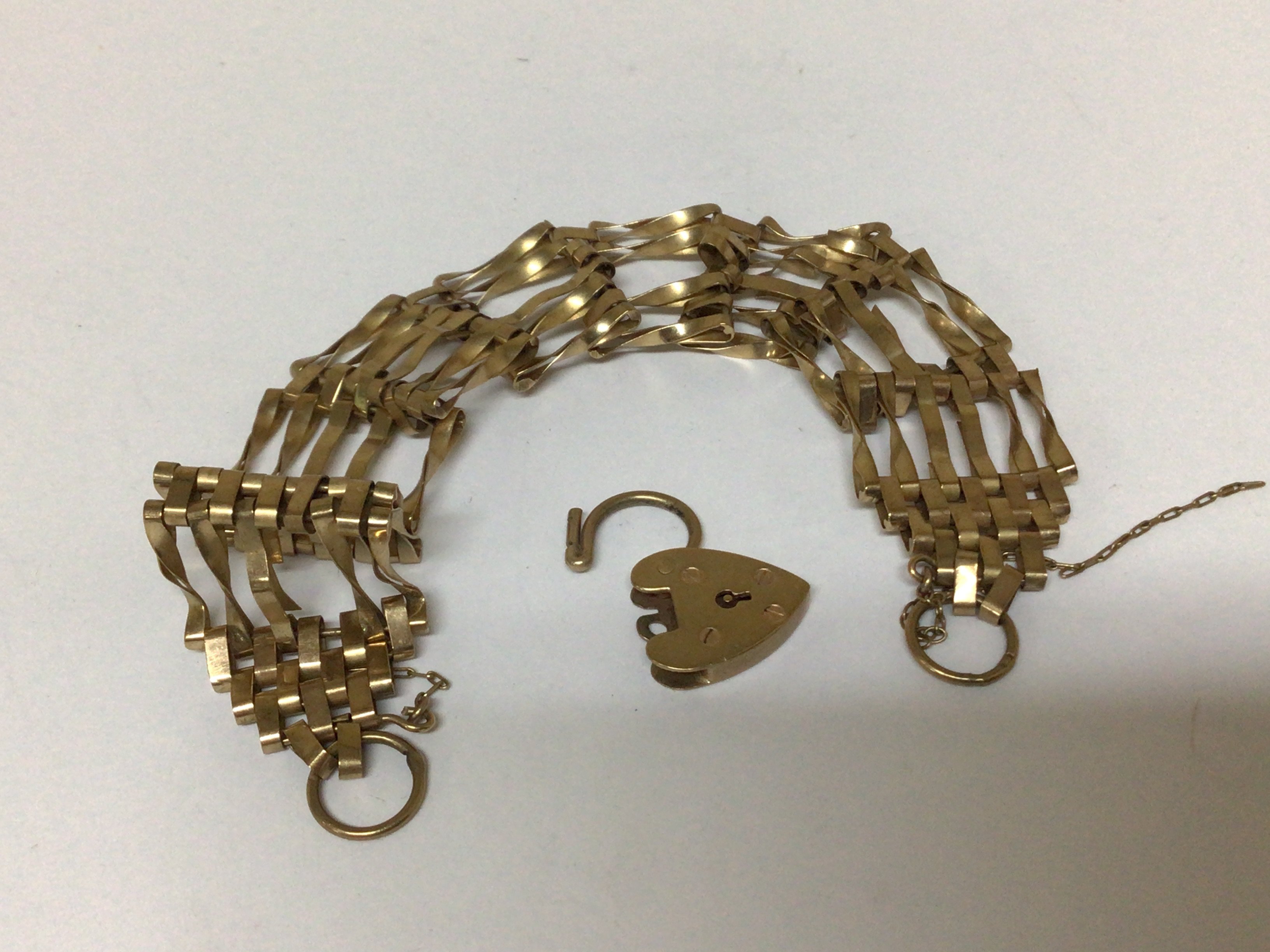 A 9carat gold gate bracelet with a padlock clasp weight 13.5g