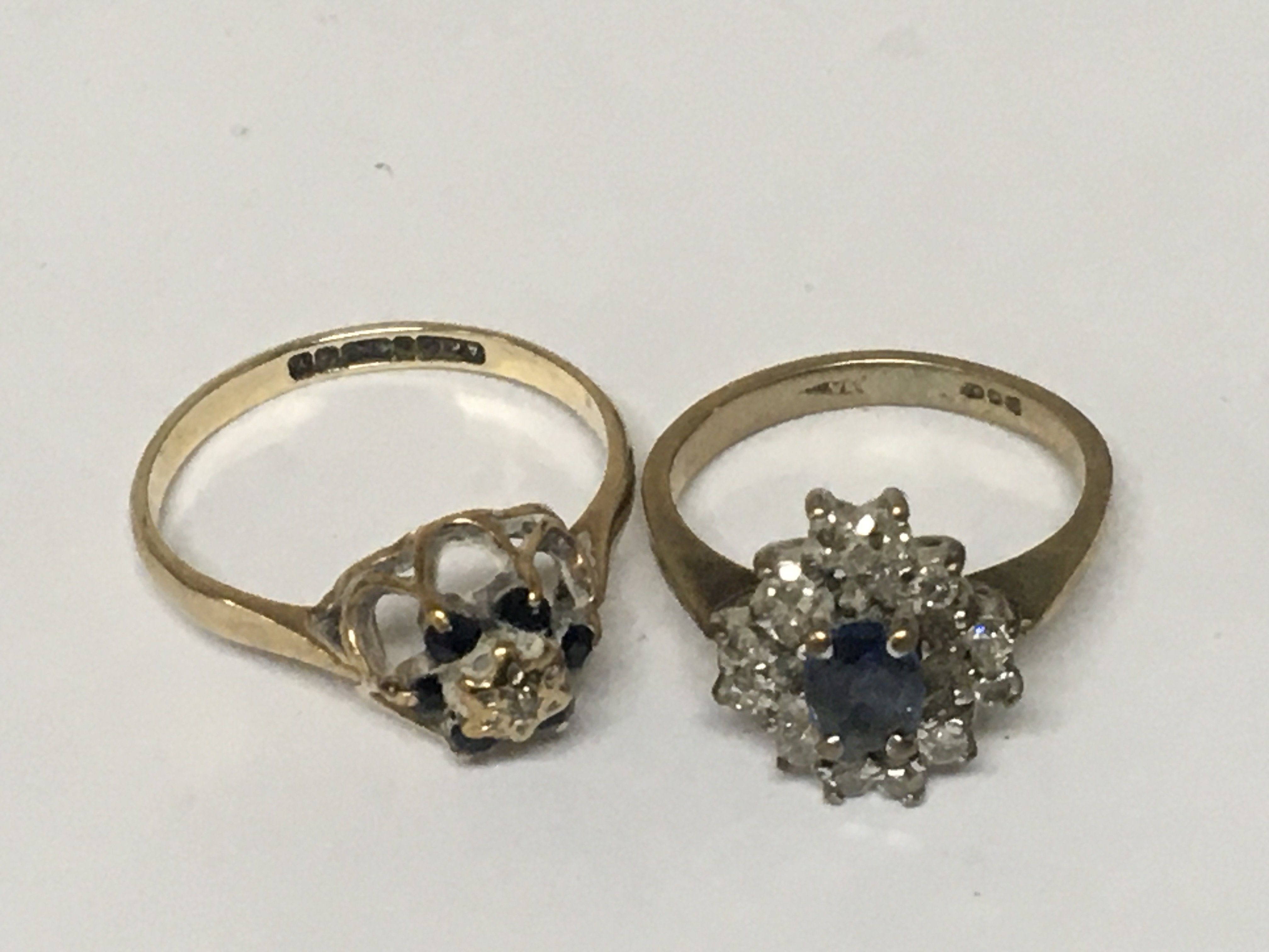 Two 9carat gold rings set with small diamonds and sapphire. (2) weight 4g