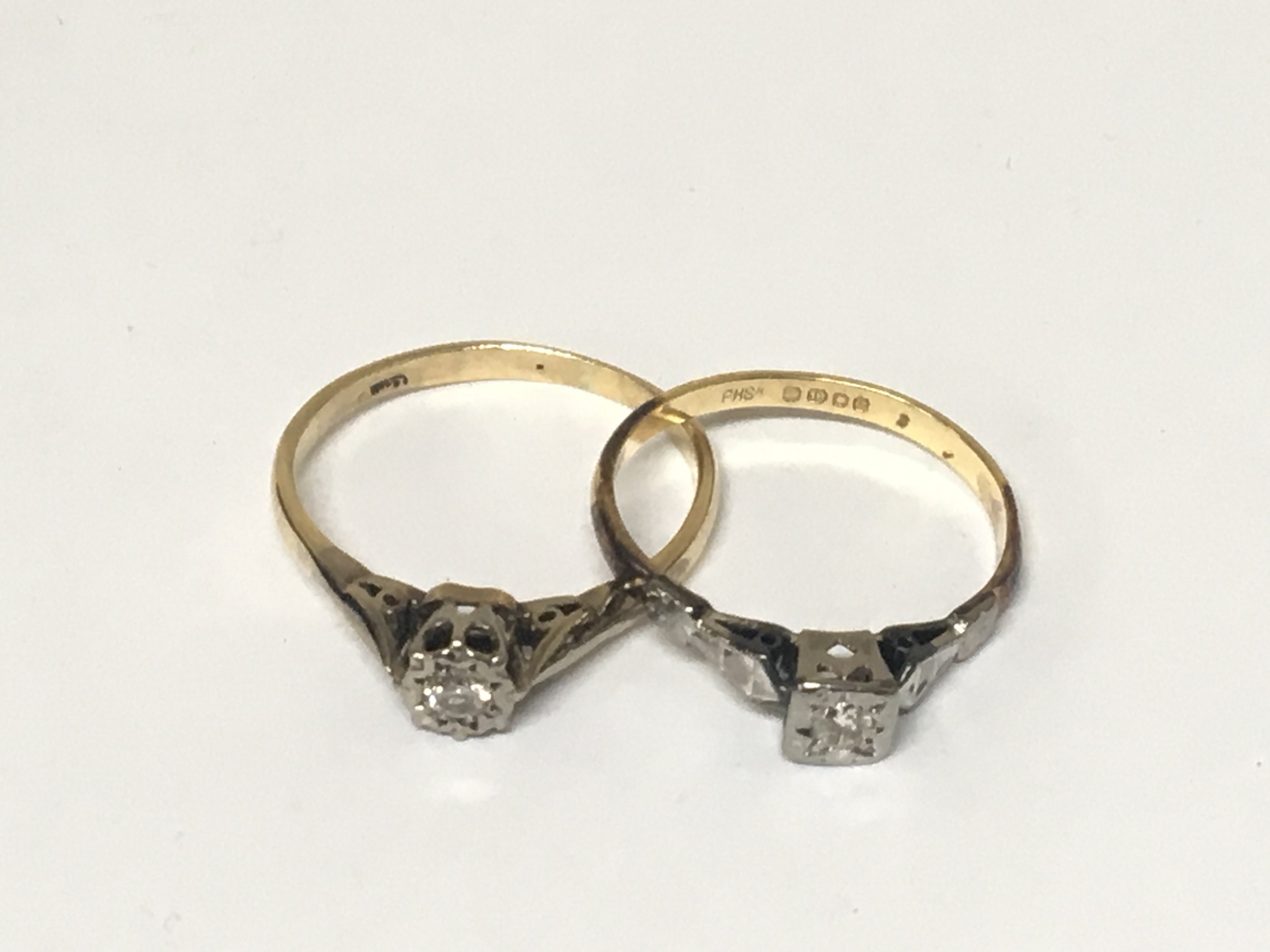 Two 18carat gold rings set with small diamonds. 5g
