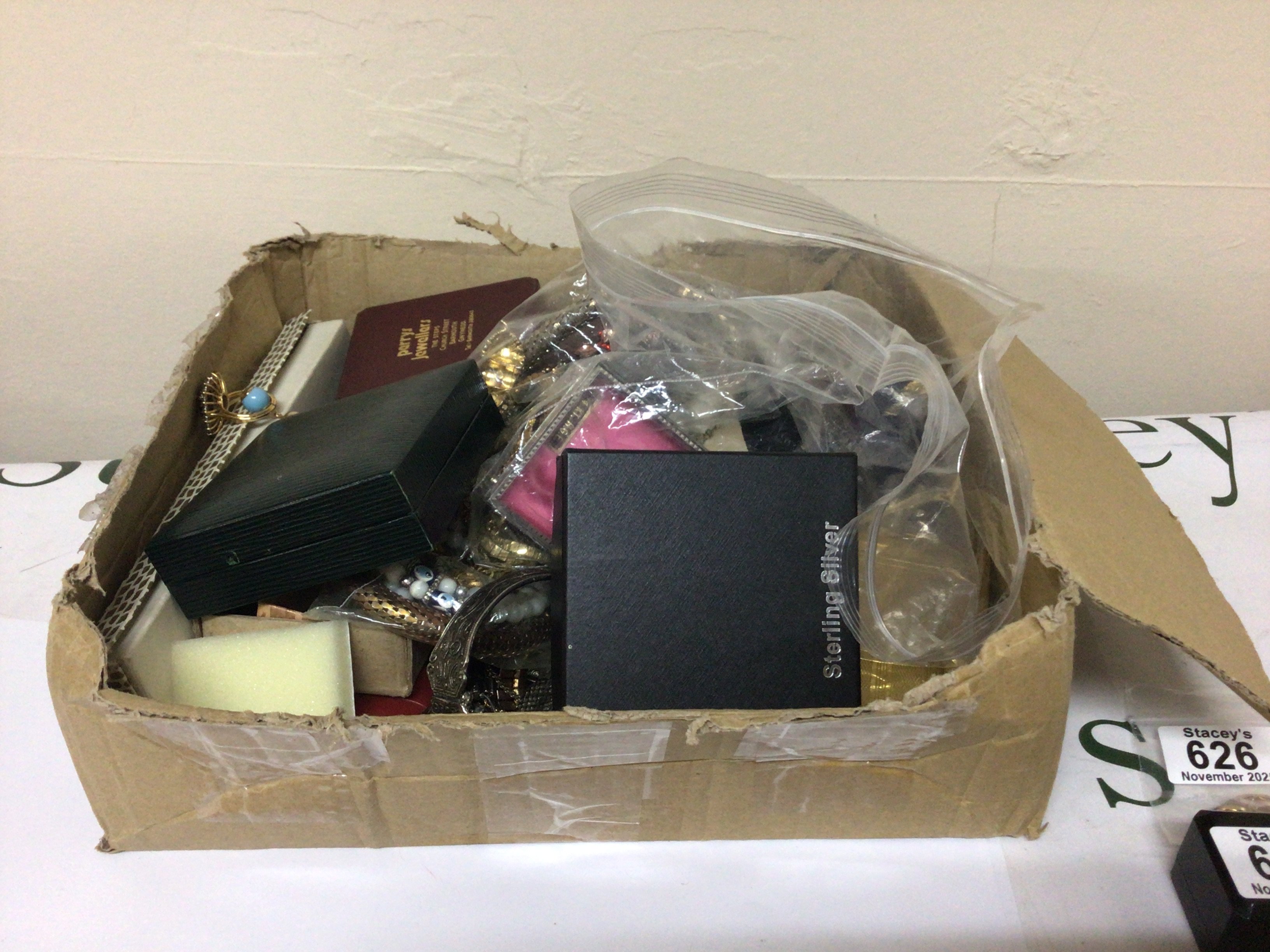 A box containing a quantity of costume jewellery.