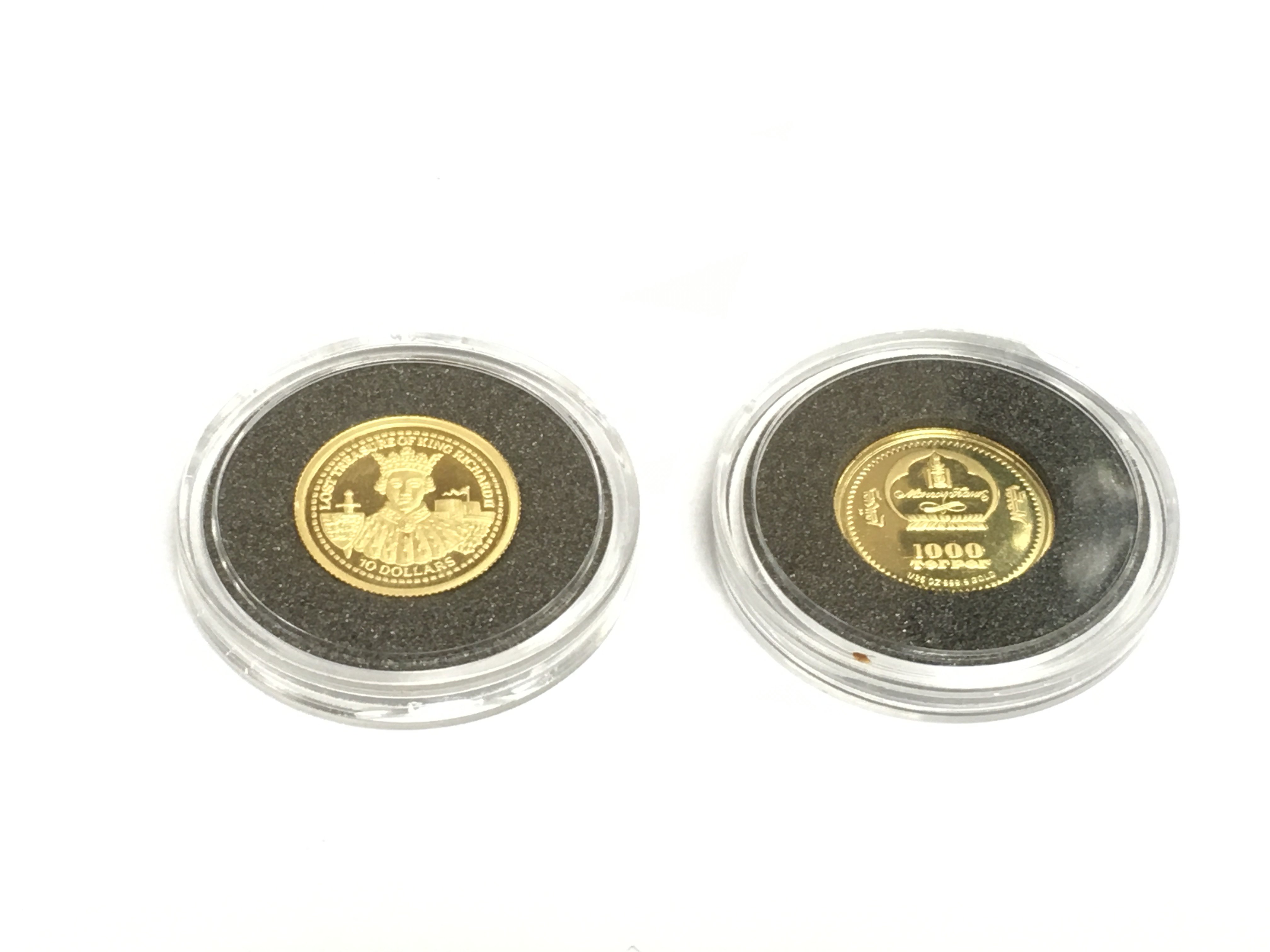 Two small gold proof coins. Shipping category A.