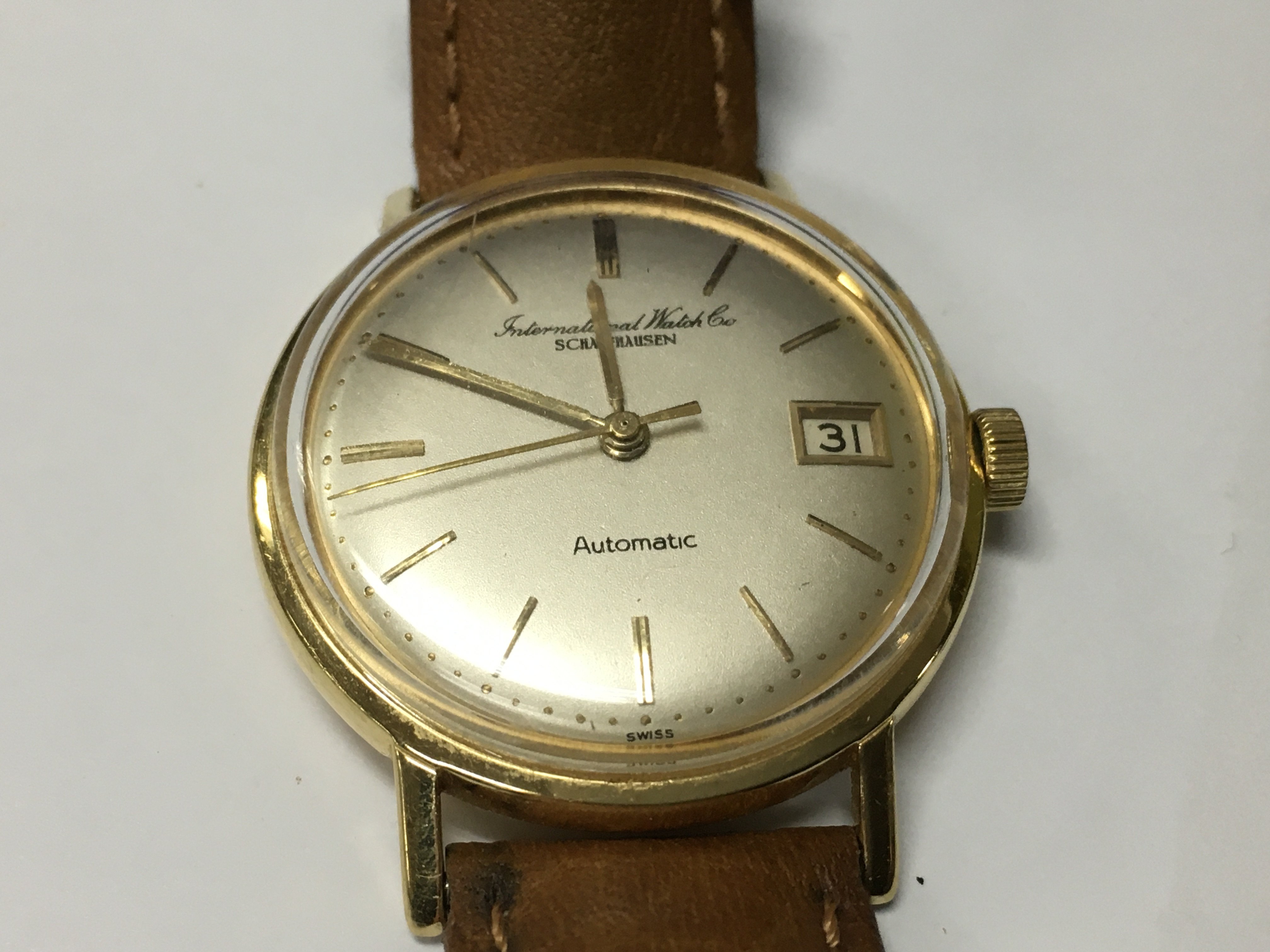 A vintage gents automatic IWC watch in an 18ct case.