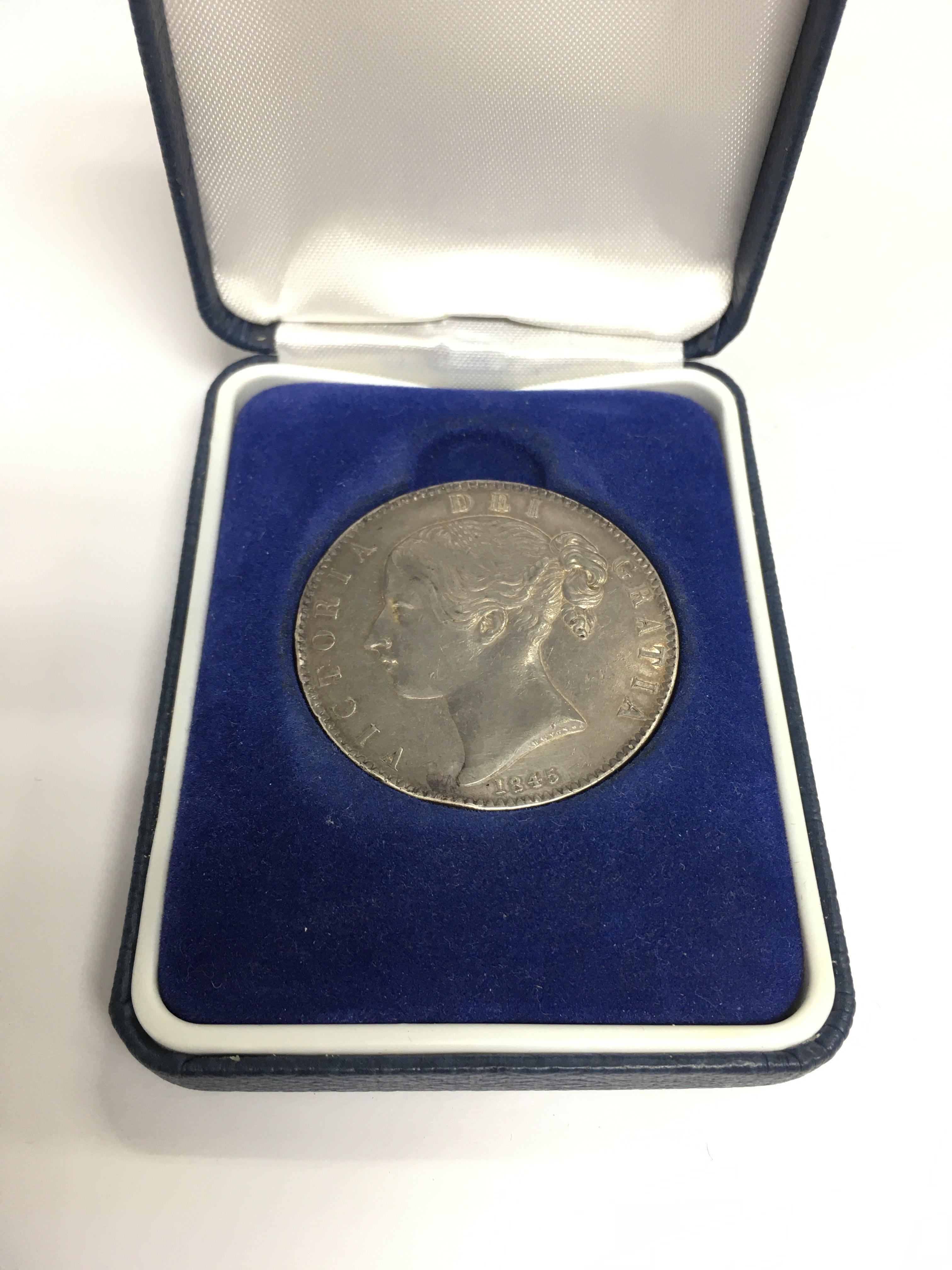 An 1845 Victorian Crown in a fitted case. Shipping category A.