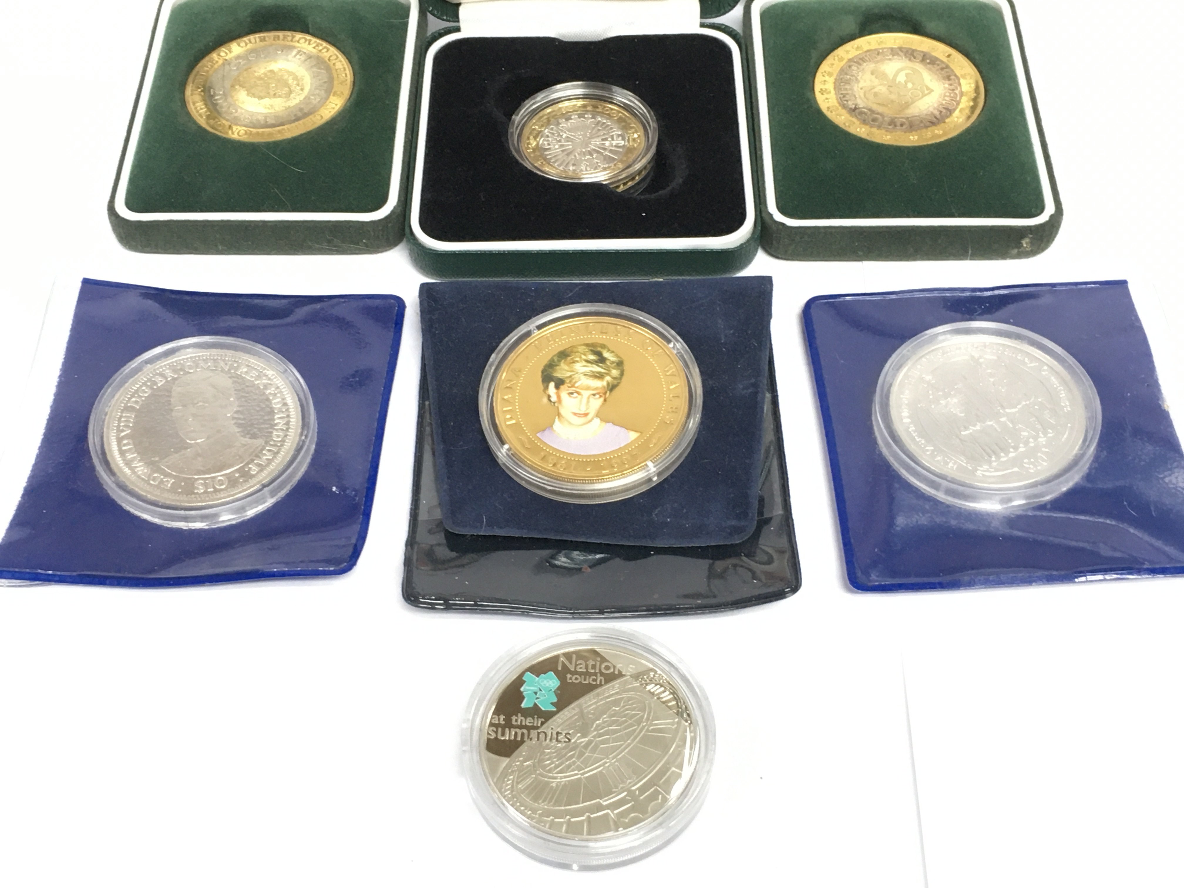 Seven silver proof British commemorative coins. Shipping category A.
