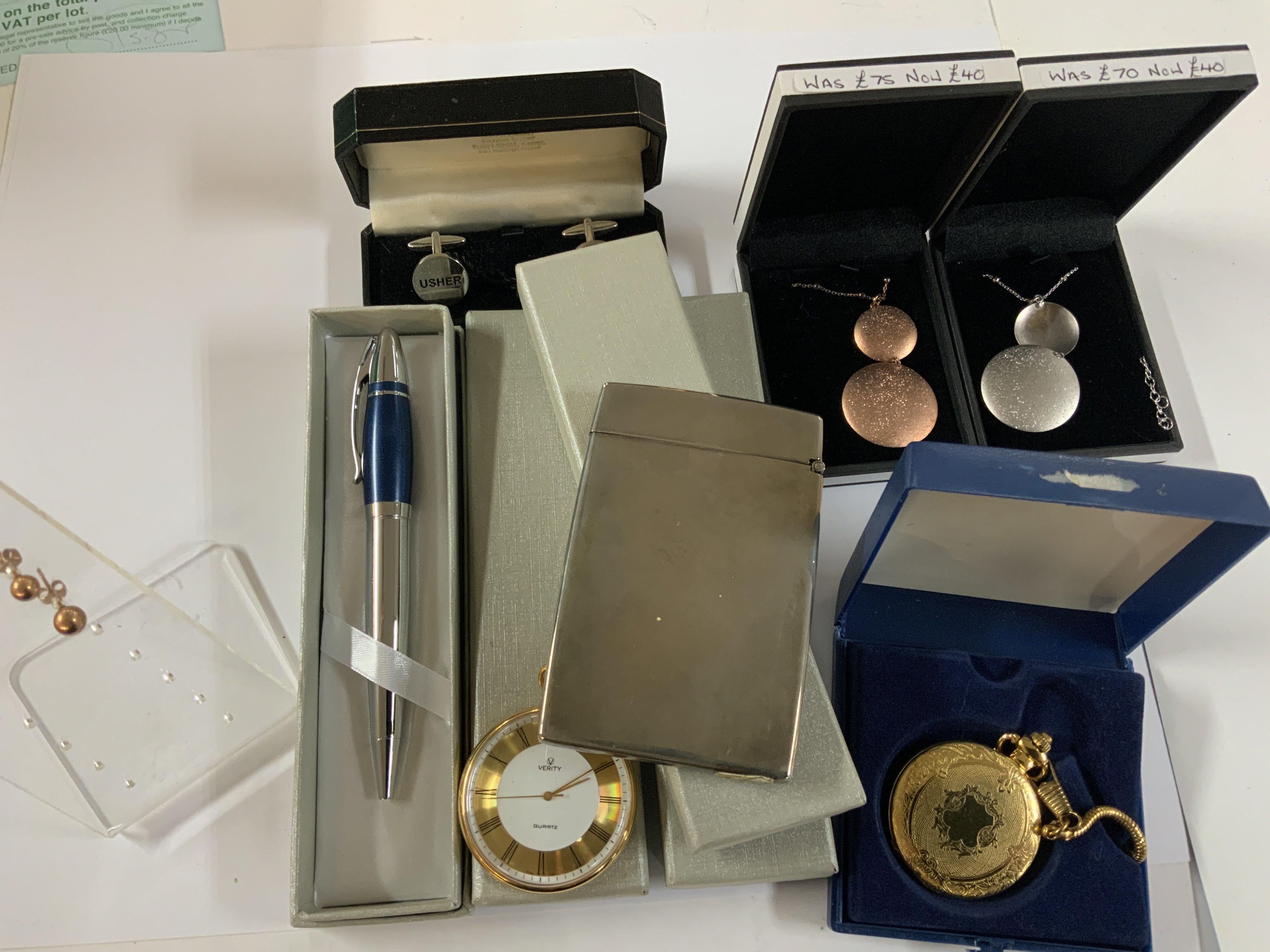 A box of mixed modern jewellery items.