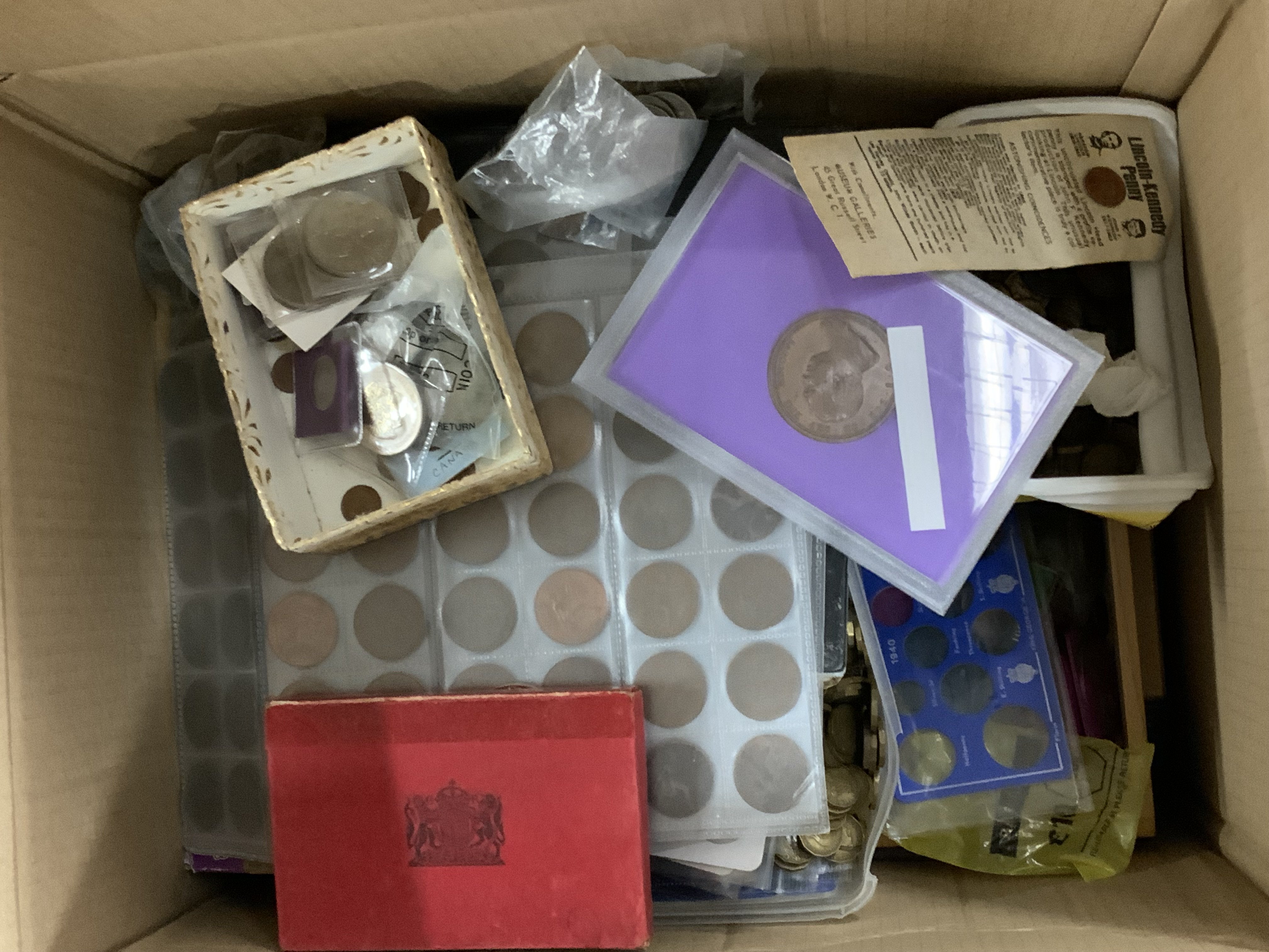 A large box of mixed British and world coinage.