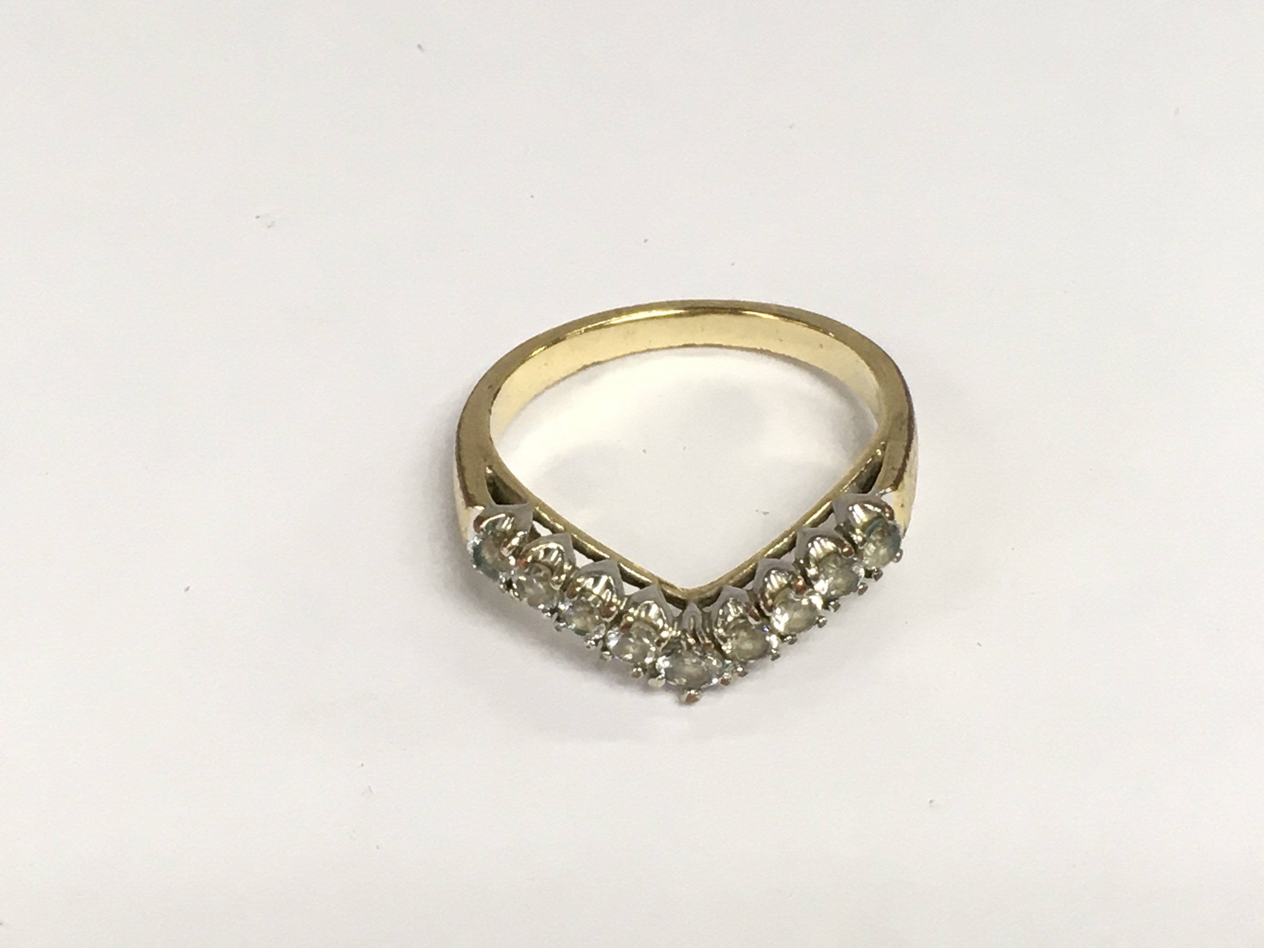 WITHDRAWN - An unmarked gold ring of wishbone design inset with diamonds, approx 2.2g and approx size L. Shipping category A.