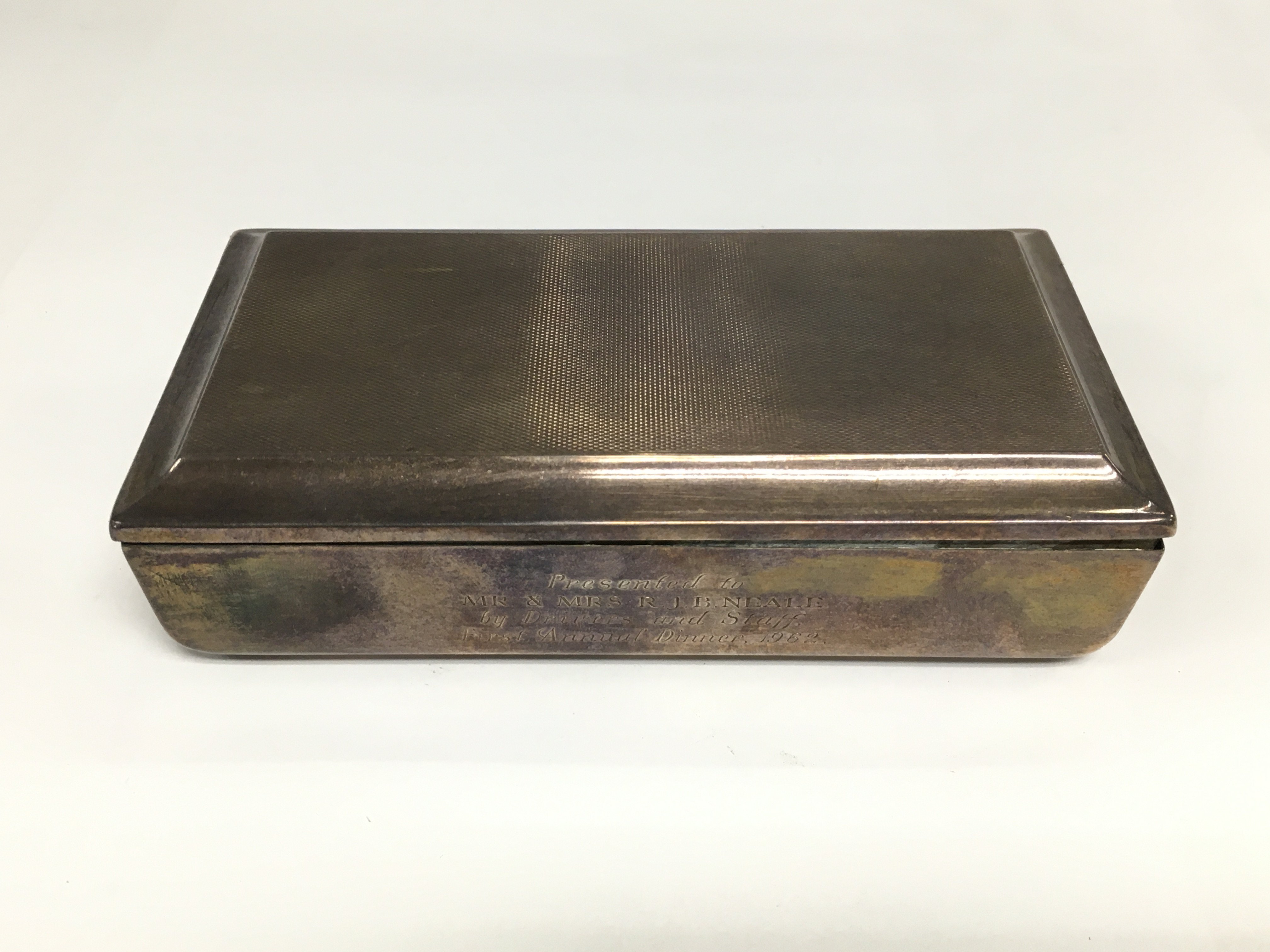 A silver cigarette box, approx length 16cm. Birmingham hallmarks. Shipping category B.