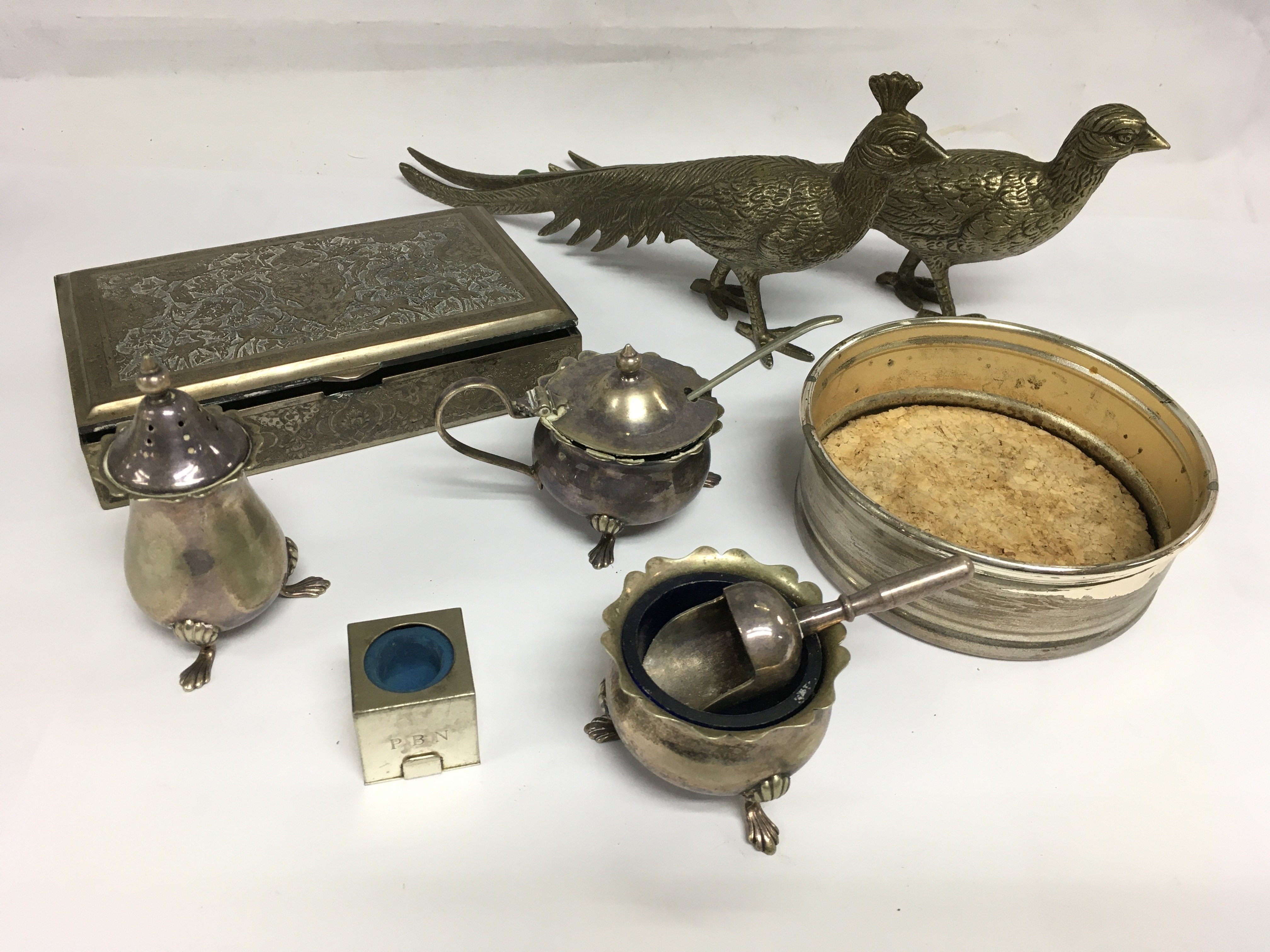 A small collection of silver plated items including cruets, wine coaster etc. Shipping category B.
