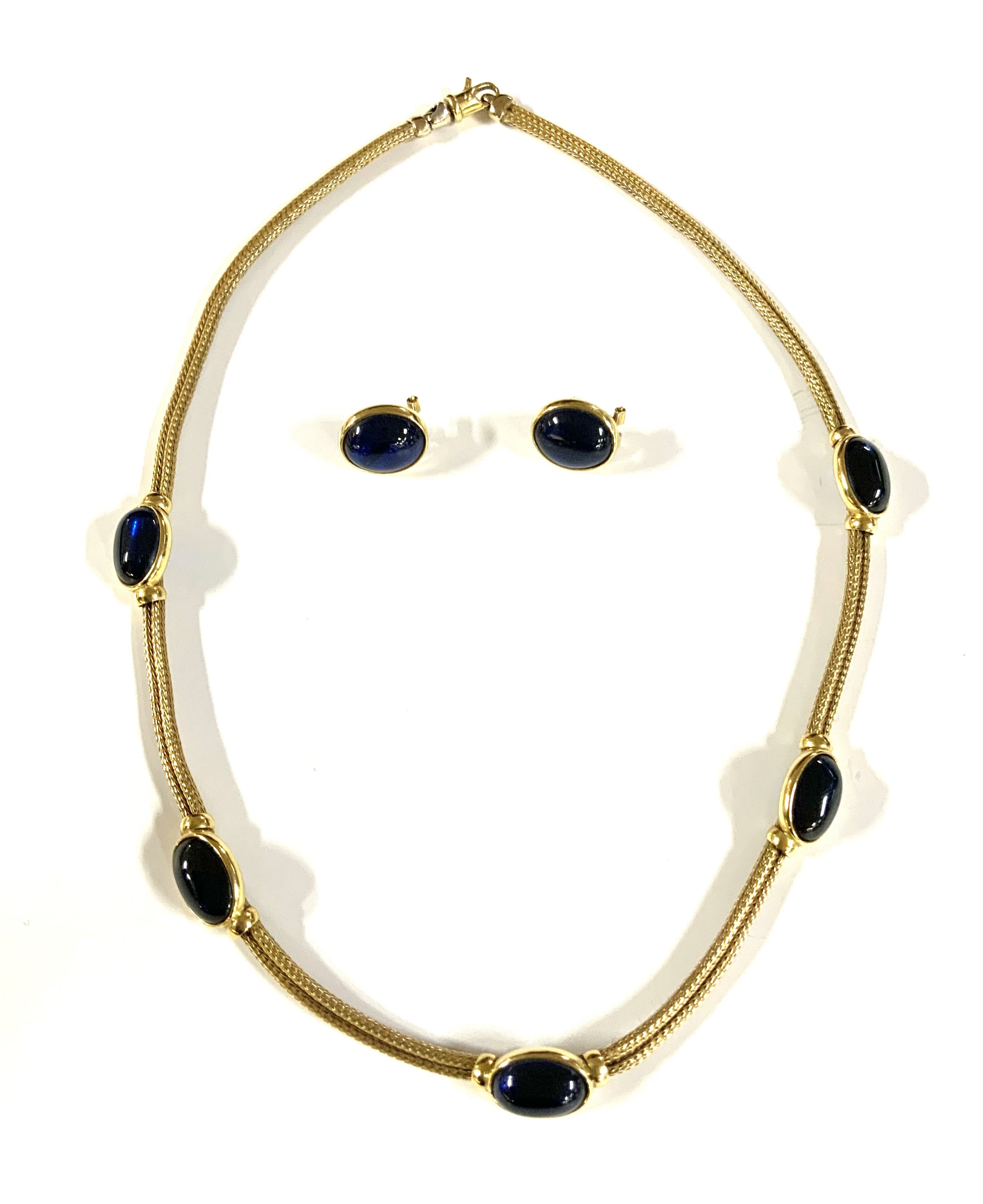 An Italian 18ct yellow gold weave necklace inset with spaced blue cabuchon stones and matching stud clip earrings. total weight 39.02g. 43cm. (A)