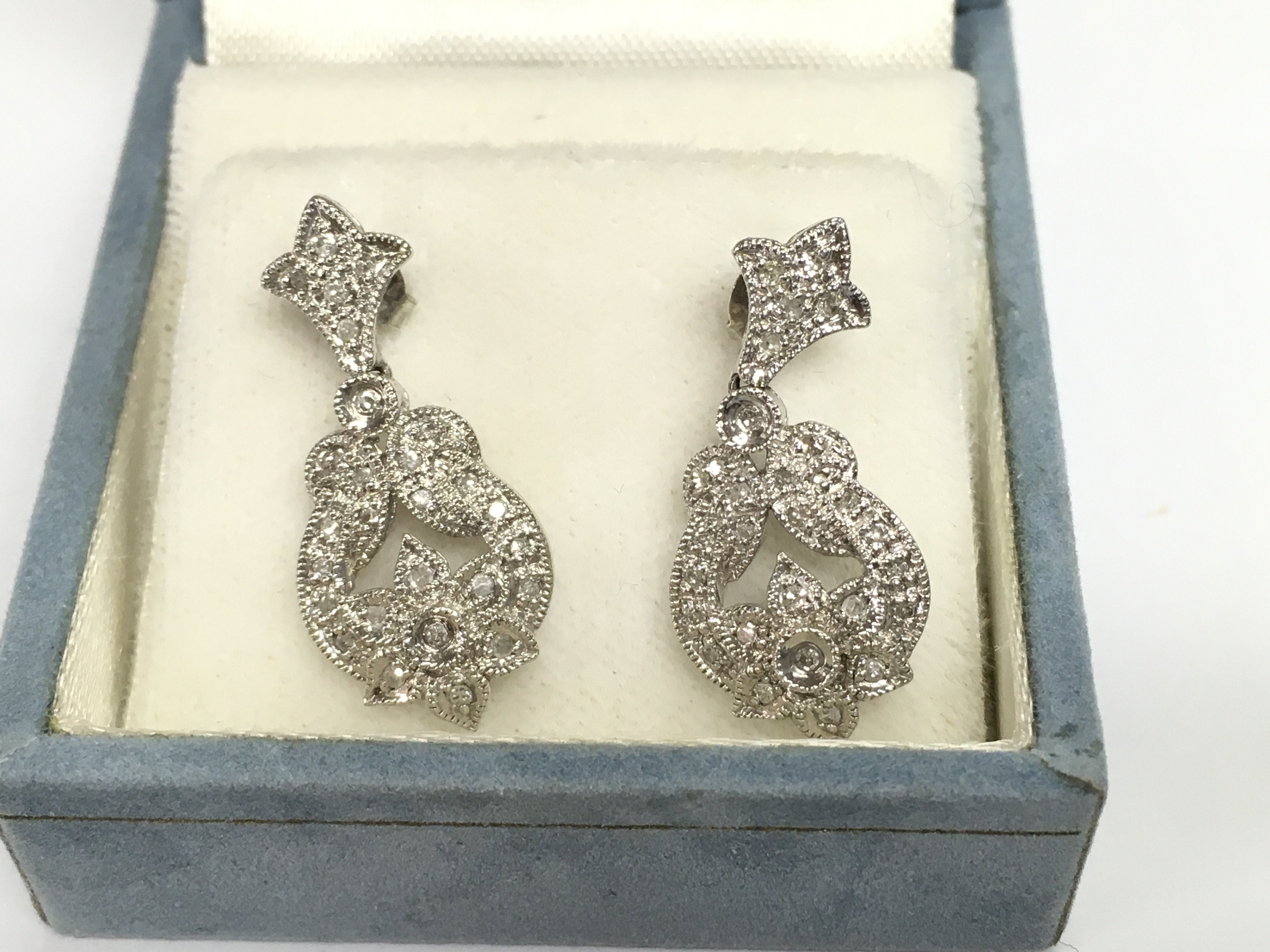 A pair of 9ct white gold Edwardian design illusion drop earrings.