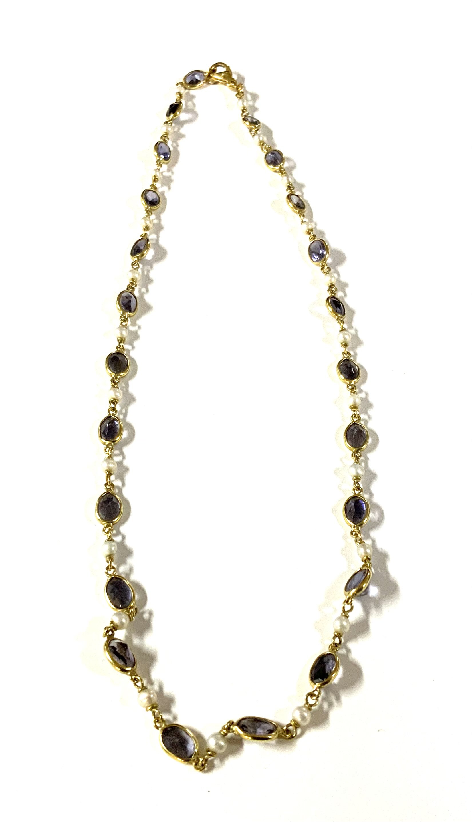 An 18ct trellis gold seed pearl and blue stone necklace. 45cm. Total weight 10.8g (A)