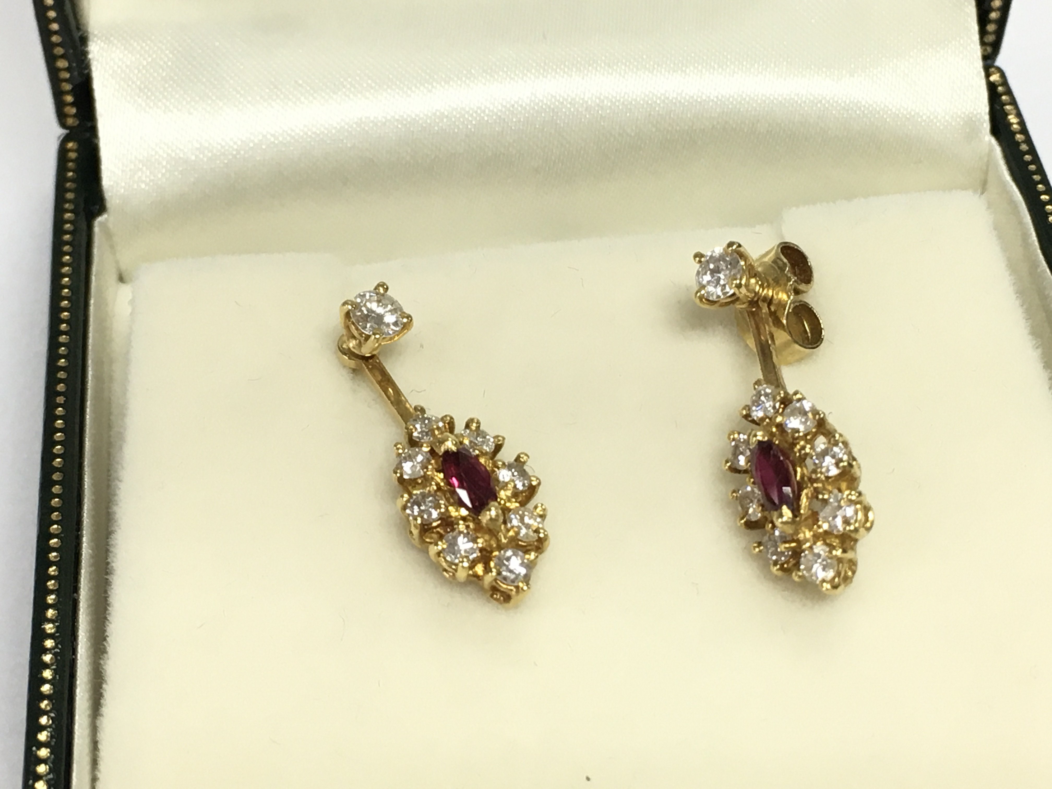 A pair of 18ct yellow gold diamond and ruby drop earrings. 3.65g Postage B