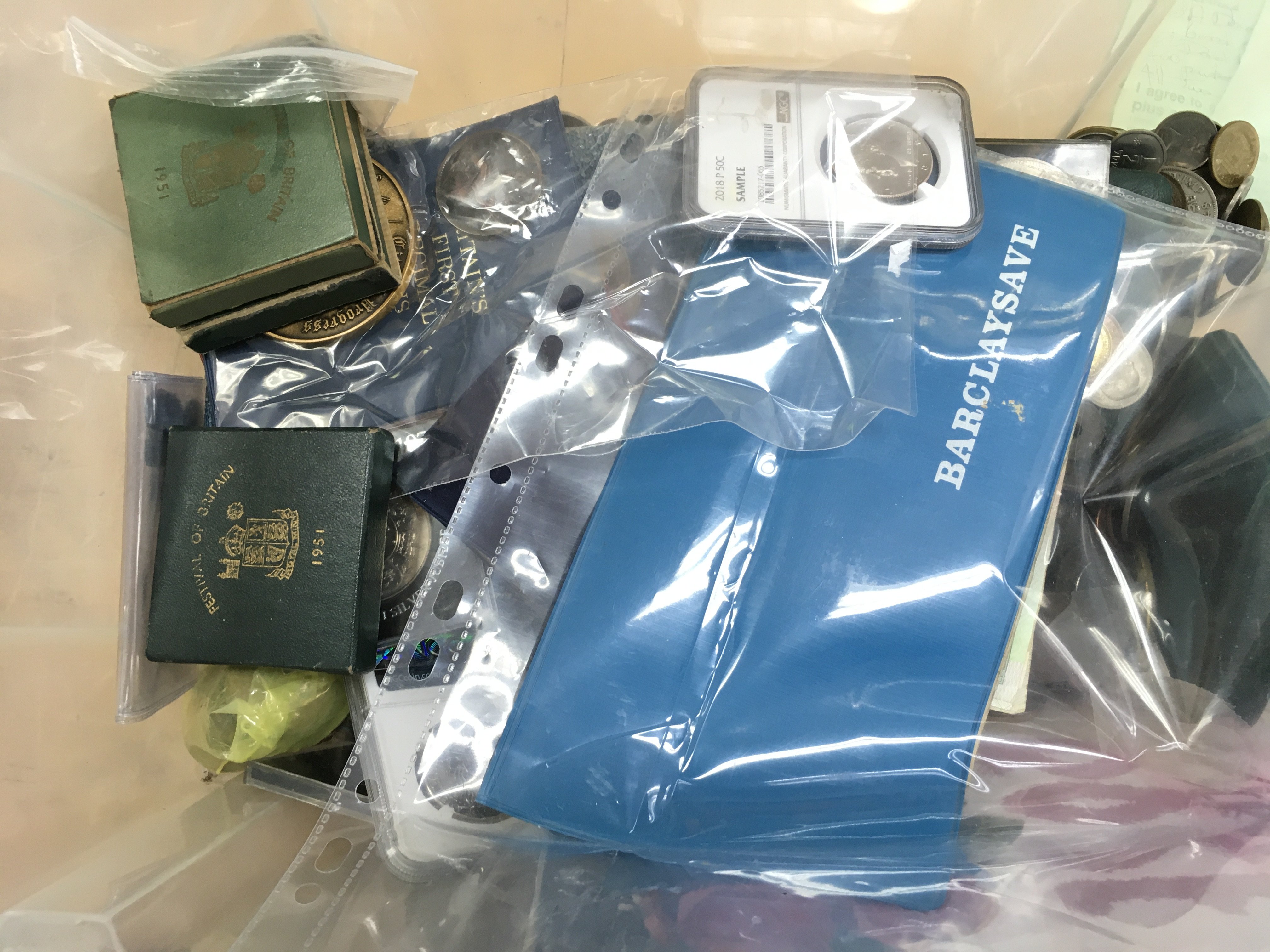 A box of coins including pennies and bank notes . This lot cannot be posted