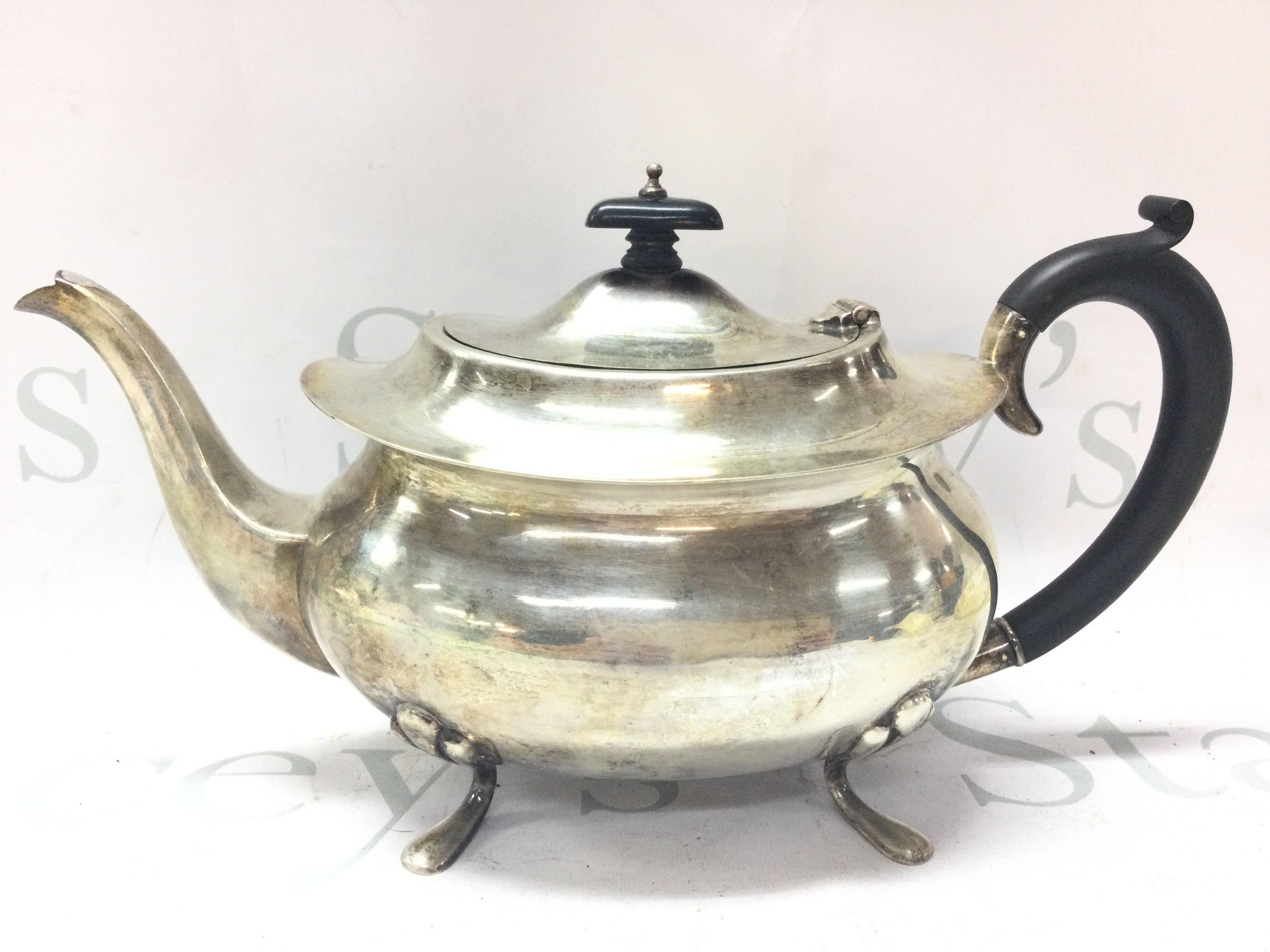 A Rococo flared Teapot . Marked Birmingham 1937 .16.5cm tall. Postage category B