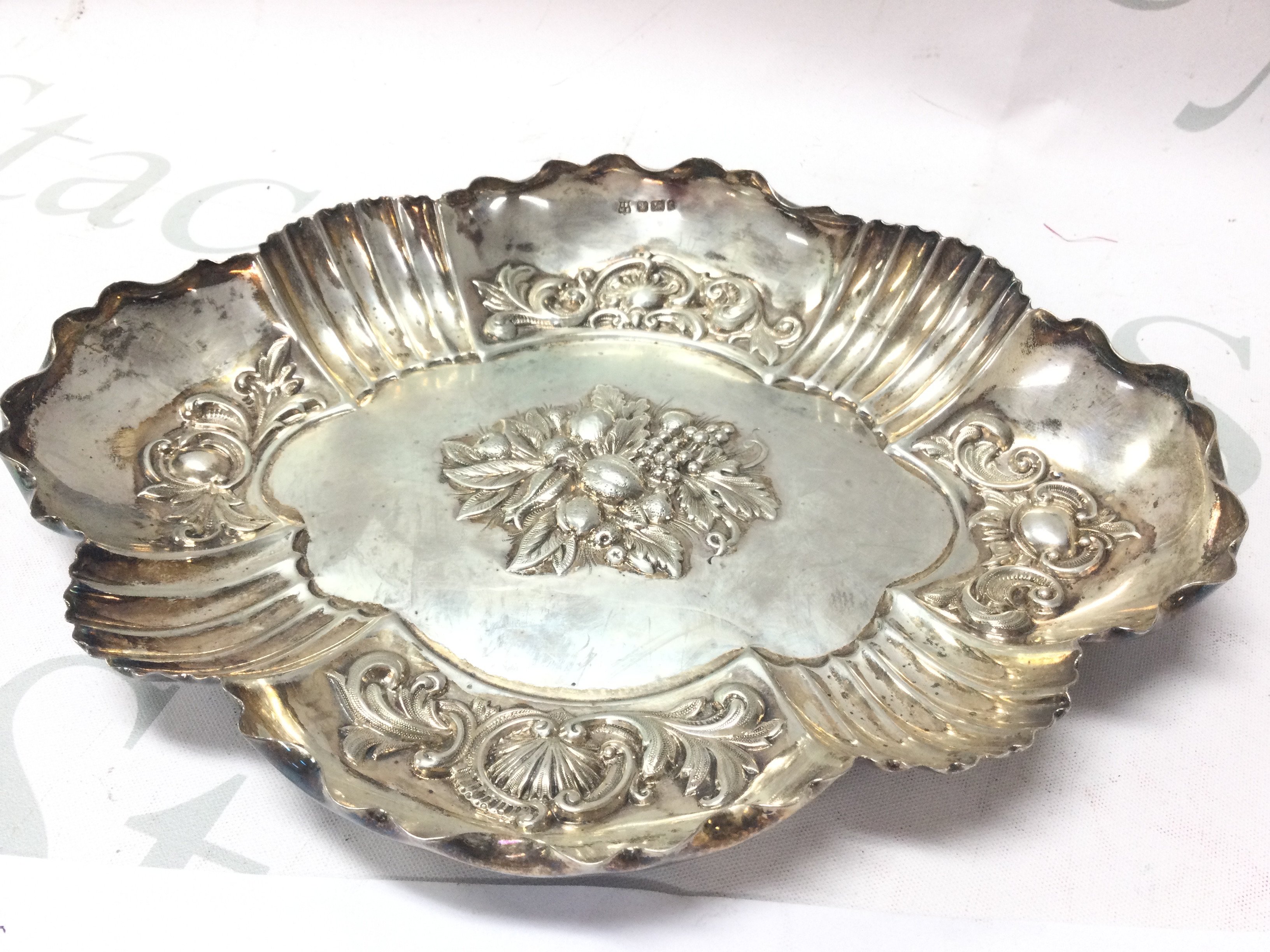 A hallmarked silver embossed fruit bowl . Marked Sheffield 1909. 23cm wide. Postage category B