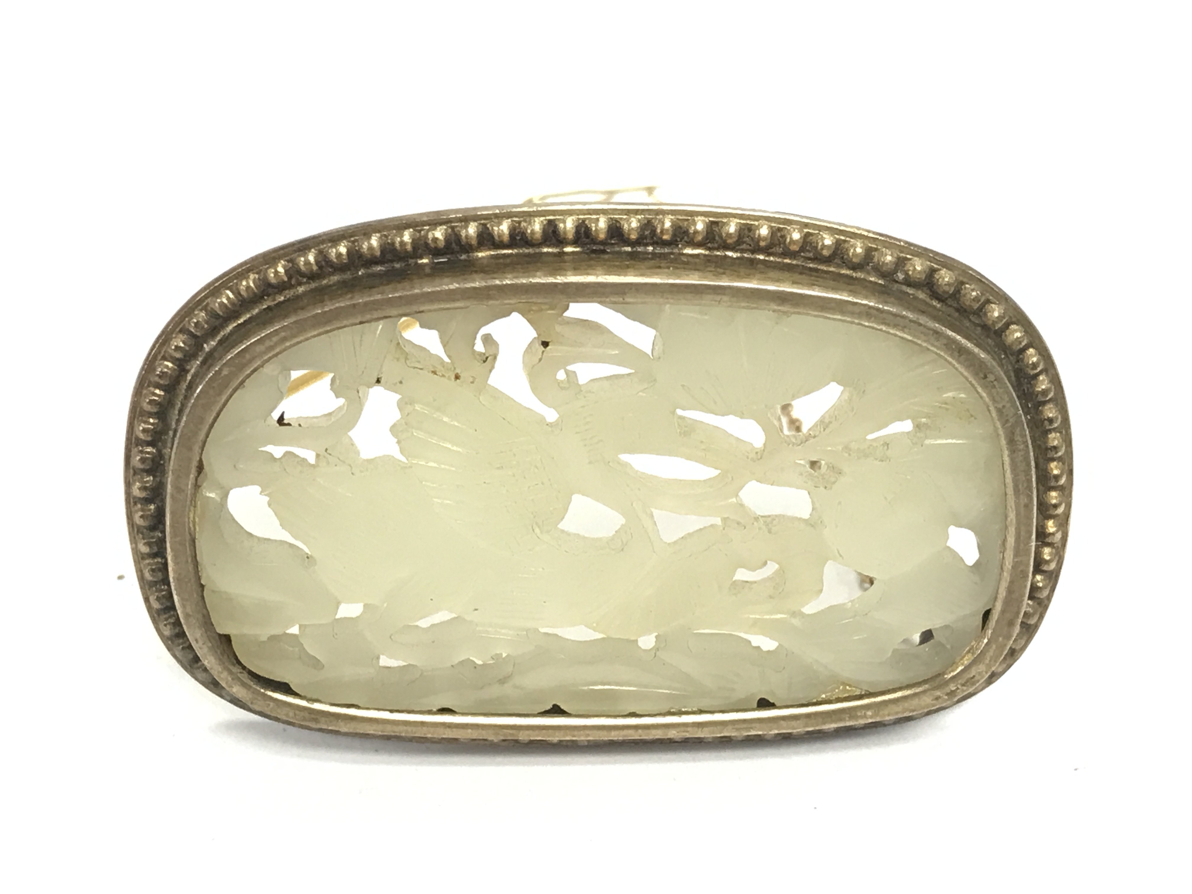 A jade brooch possible from 1920s 30s 6cm wide 4cm high.