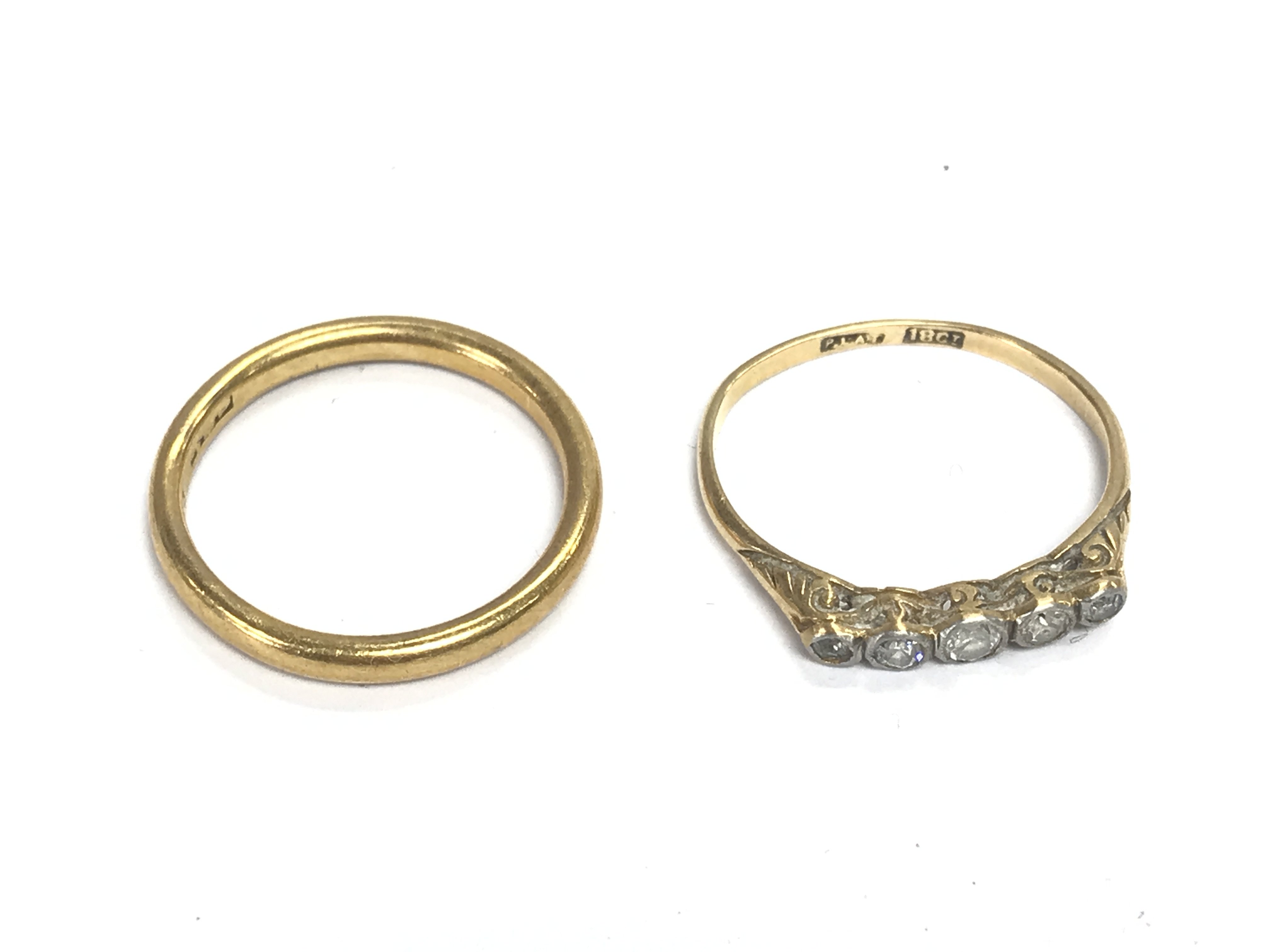 A 22ct gold wedding band 3.52g and an 18ct gold and platinum diamond set ring size M 1.56g Postage A