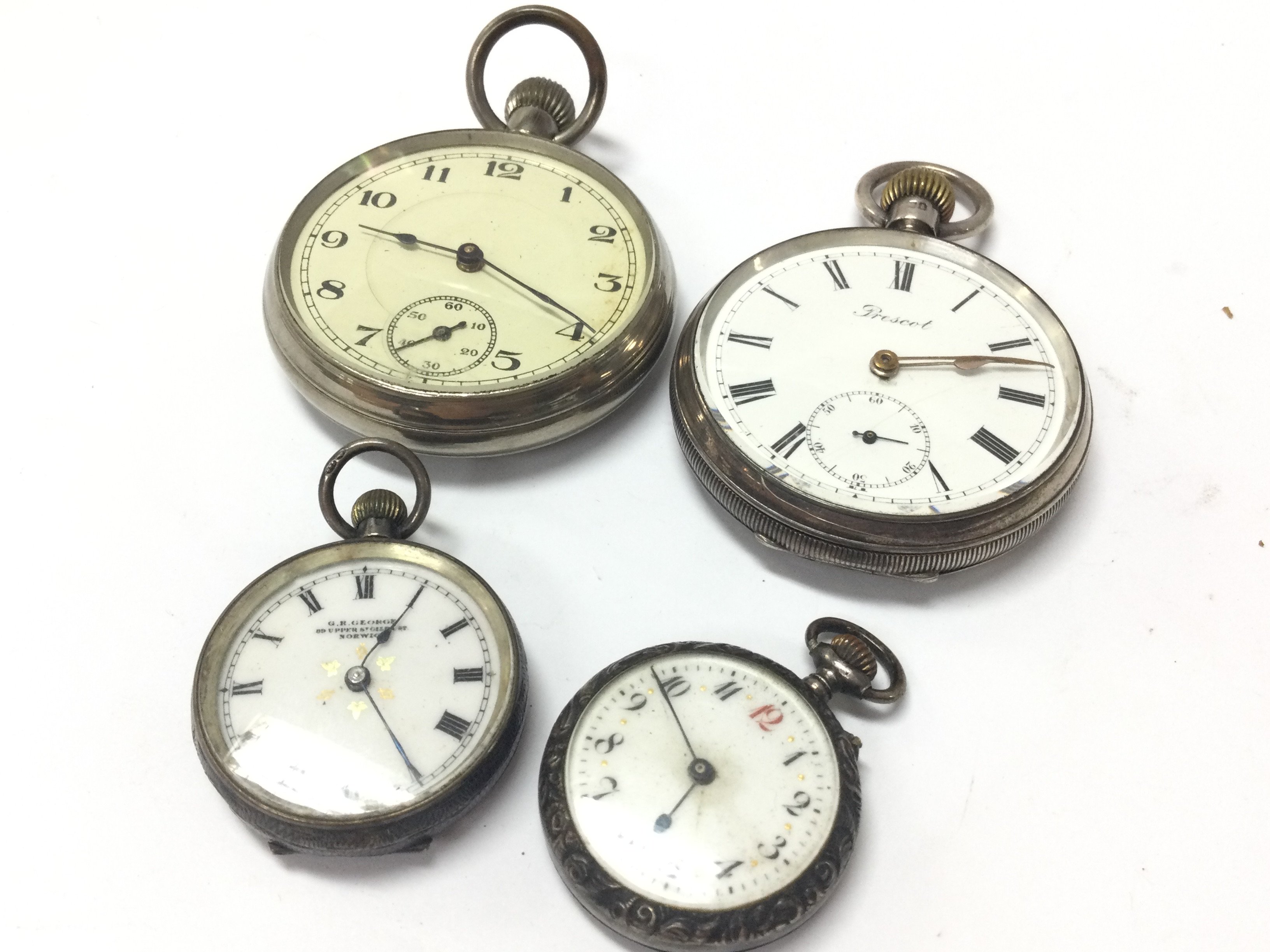 A hallmarked silver pocket watch , two silver ladies pocket watches, one chrome plated. Postage category B