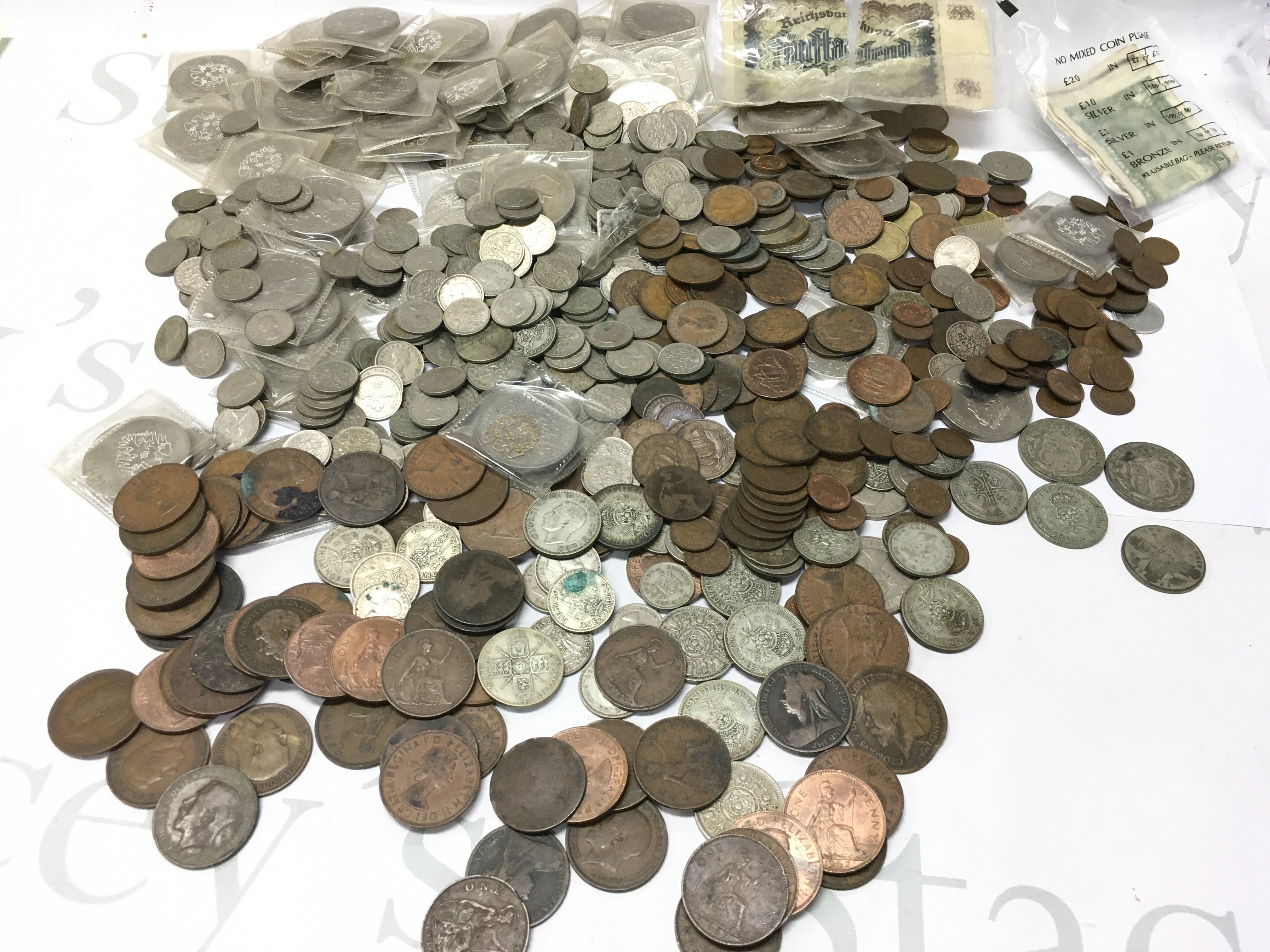 A collection of British coins including pennies, half crowns, shillings, six pence Etc . Postage category B