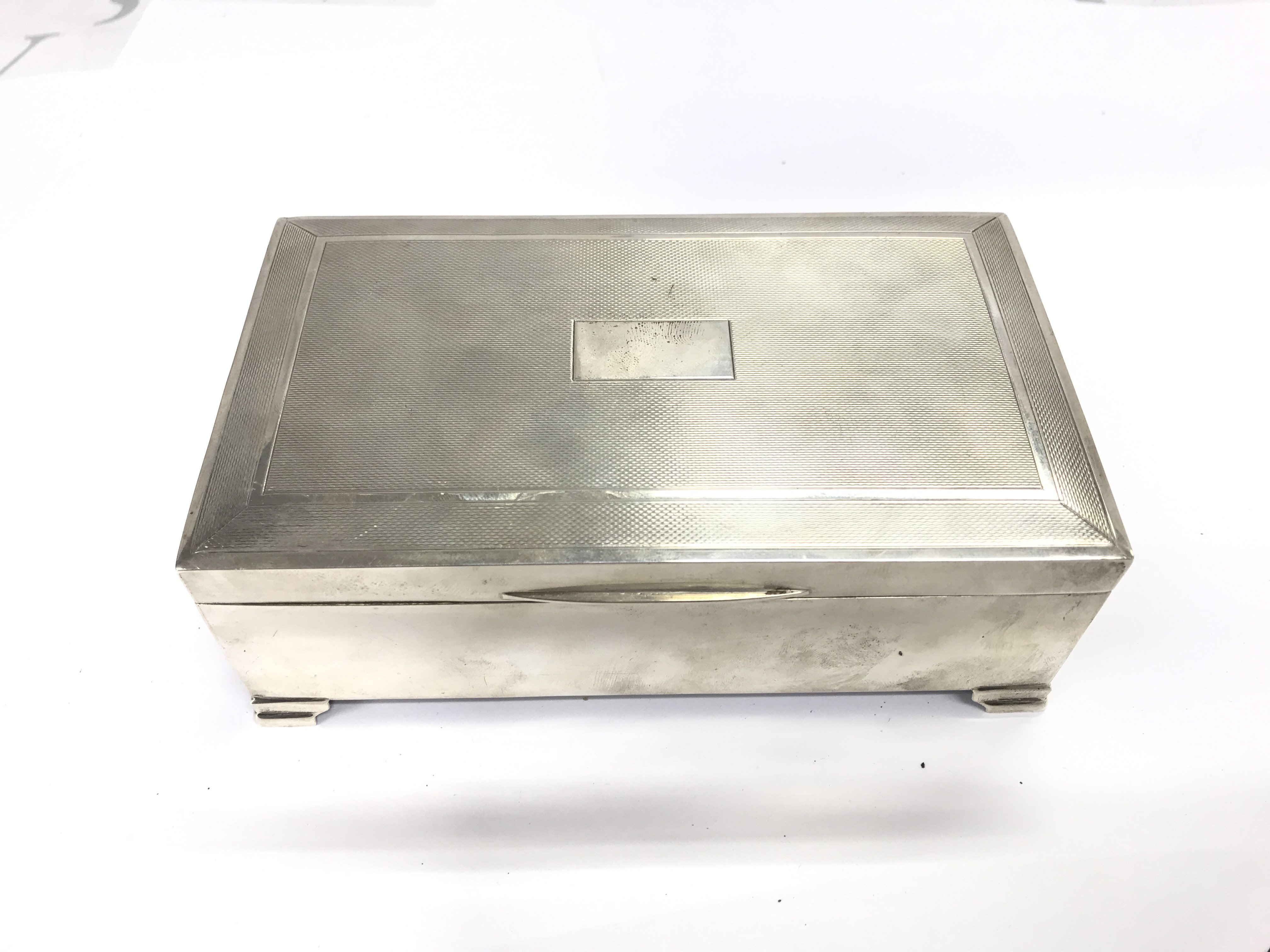 A Birmingham hallmarked silver cigar box circa 1963. Approximately 15.5cm wide 6cm tall and 9cm deep.