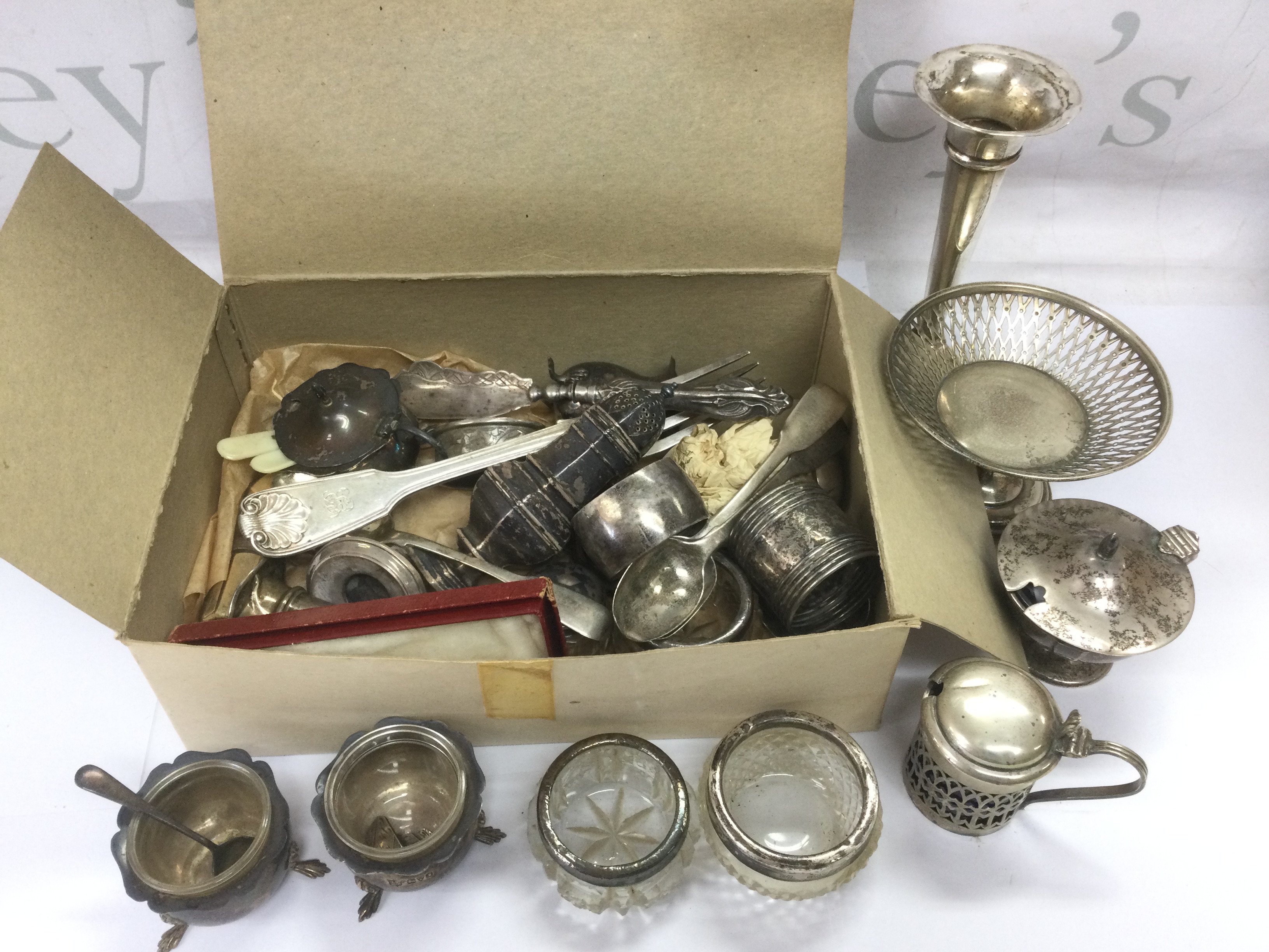 A small box of mixed silver items comprising cruets, cutlery etc. Shipping category D.