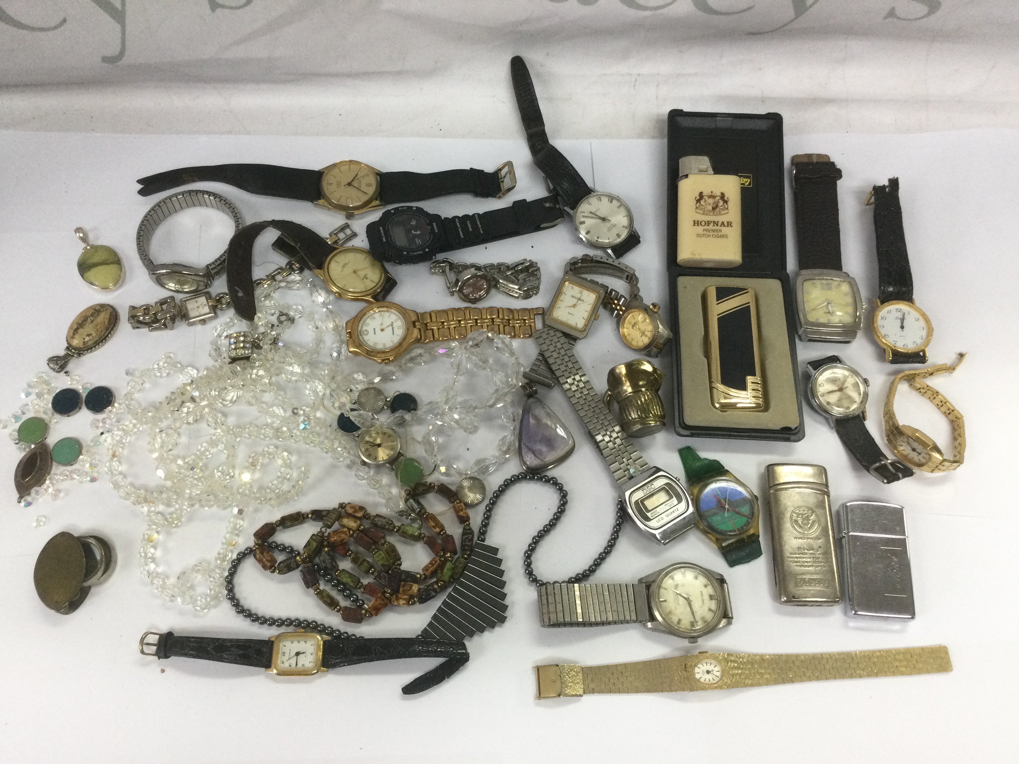 A collection of watches including a Seiko Seahorse and various others plus some lighters and jewellery. Shipping category D.