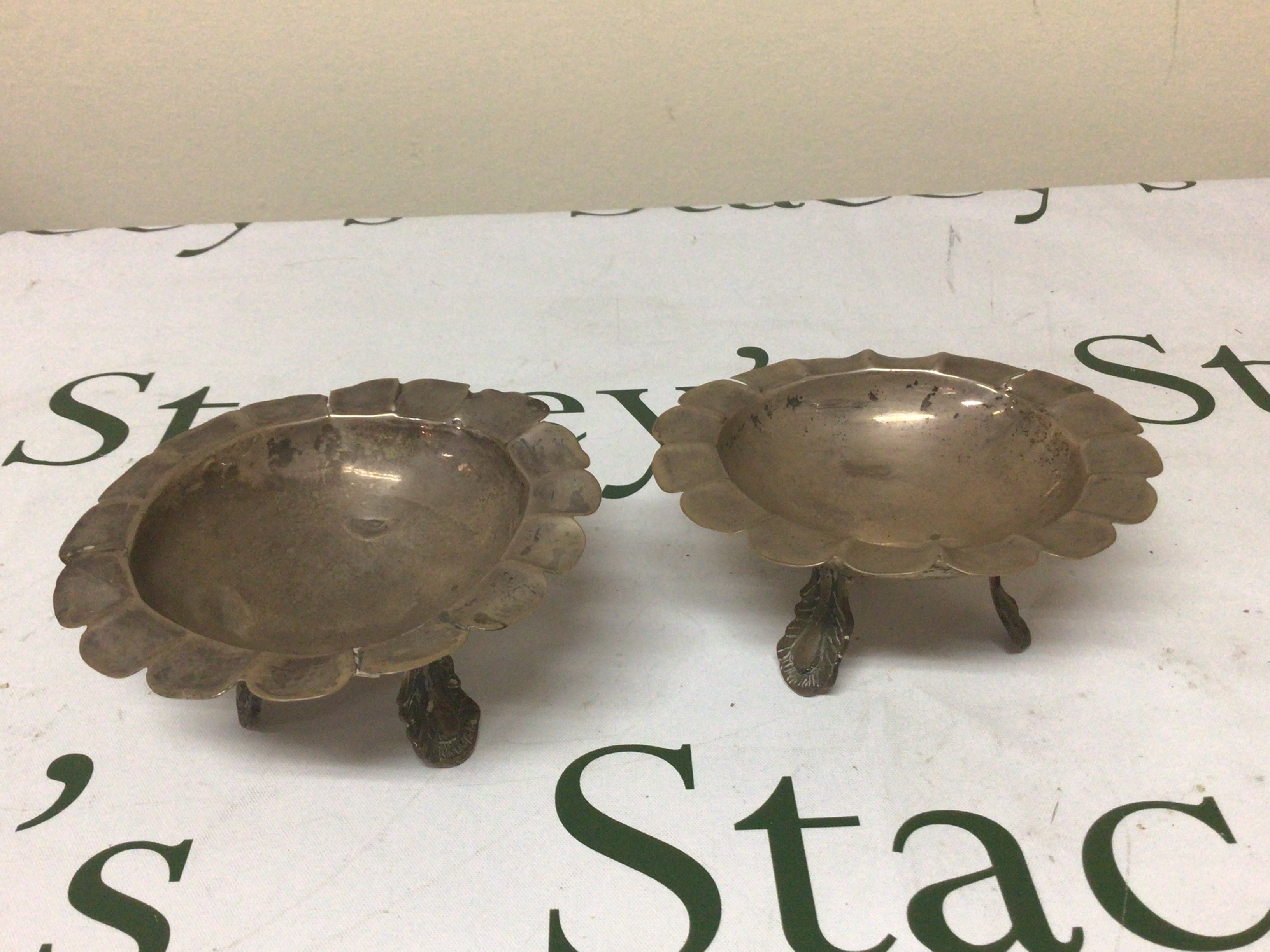 A pair of white metal dishes possible Mexican. Weight 235g