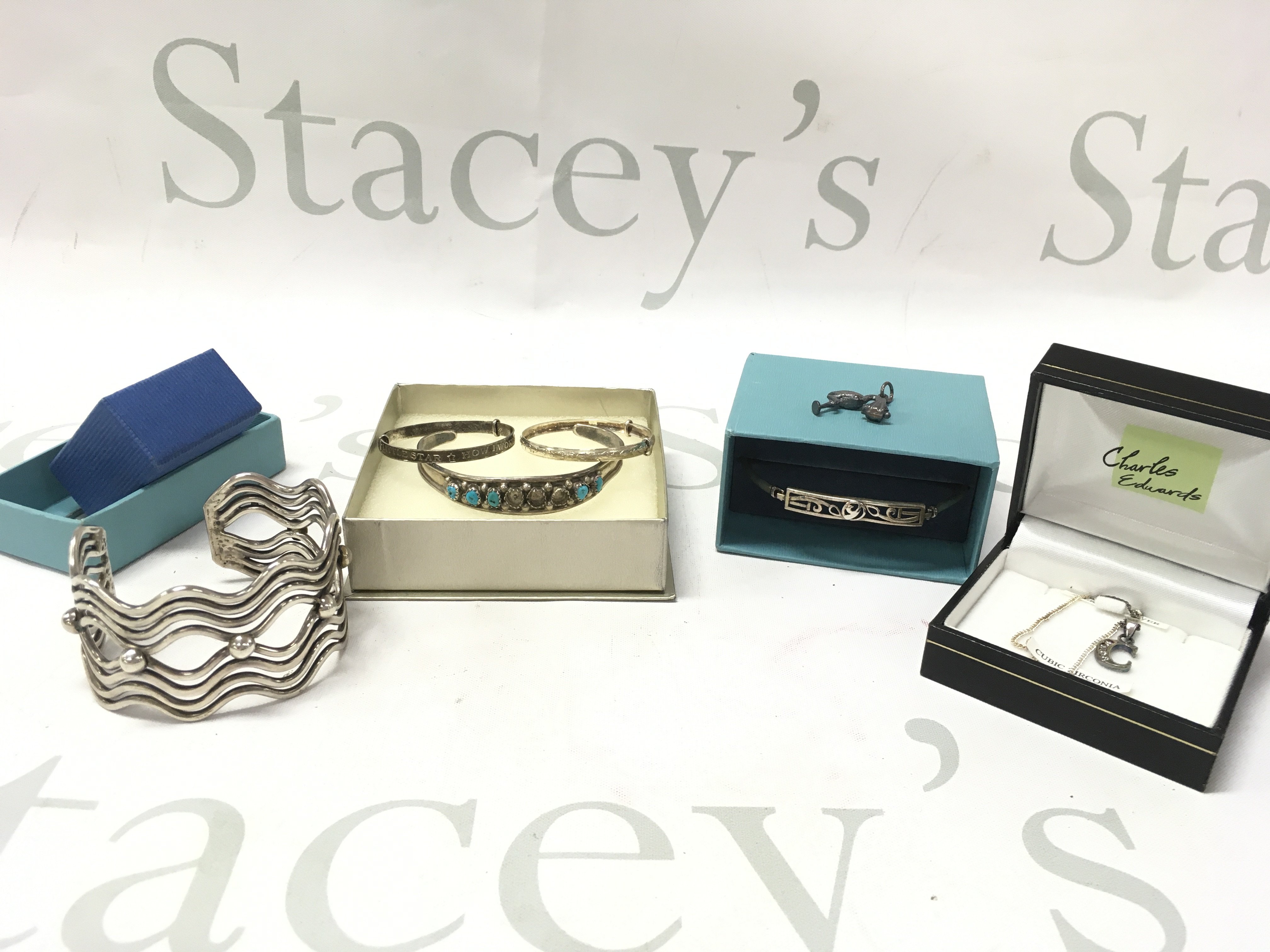 A mixed collection of silver Jewellery including a Mexican bracelet, necklace Etc. Postage category B