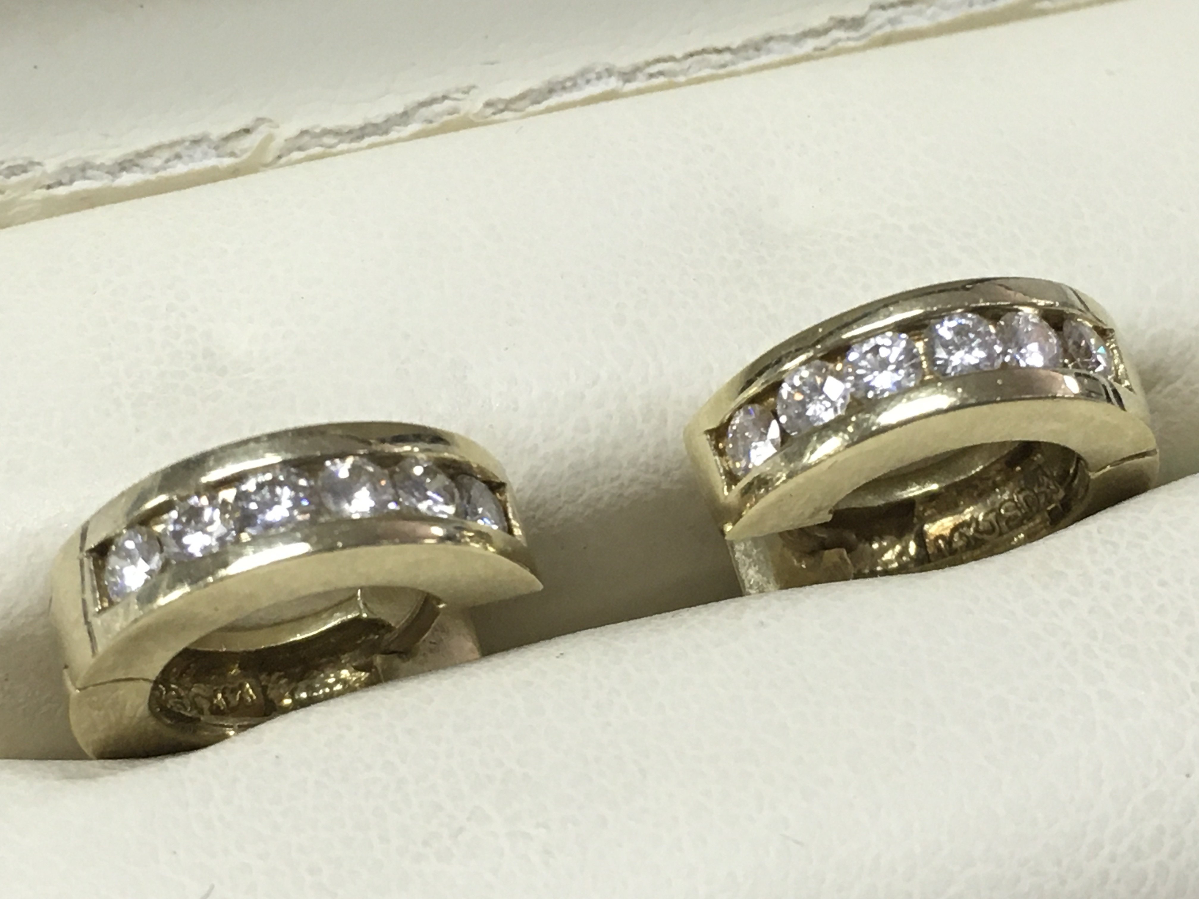 A pair of small hoop 14ct and diamond earrings , 9g total weight. Postage category A