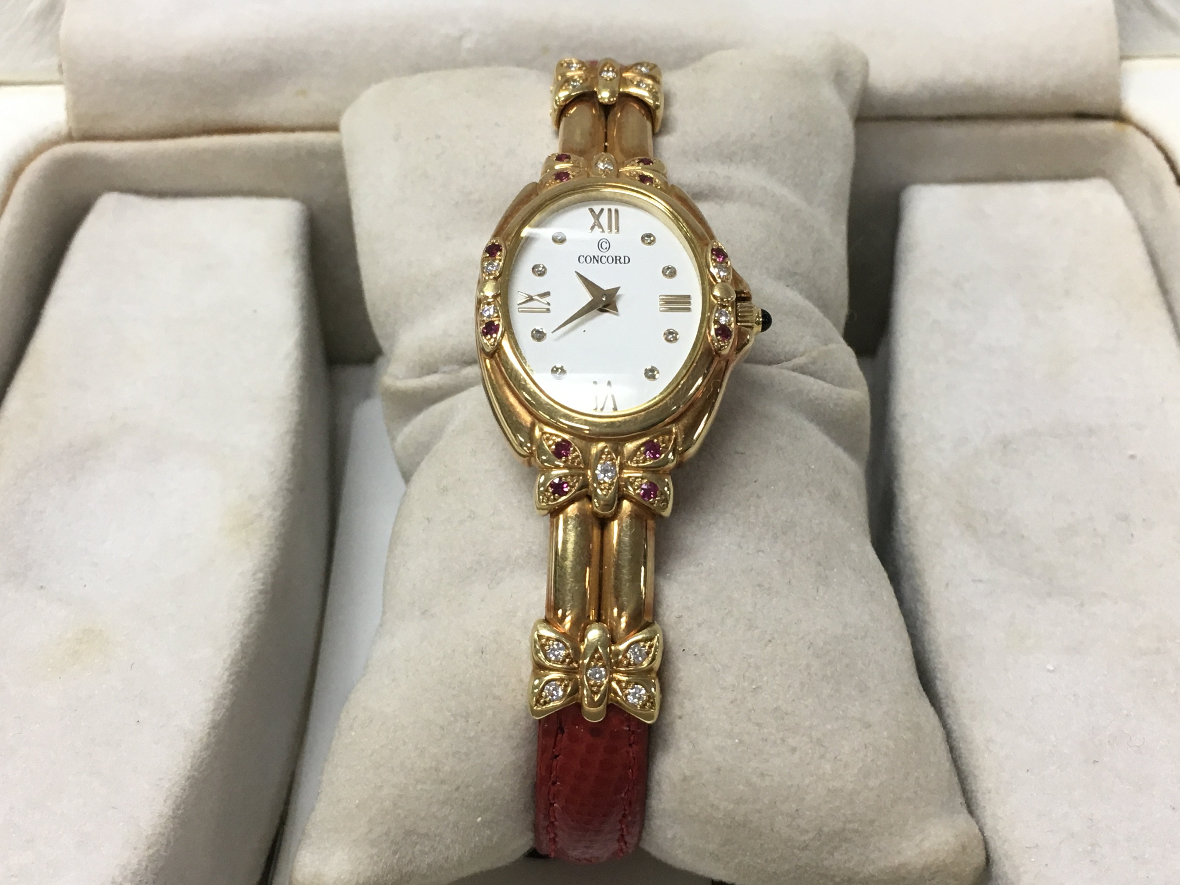 An 18ct gold Concord ladies watch, with certificate.Postage category A