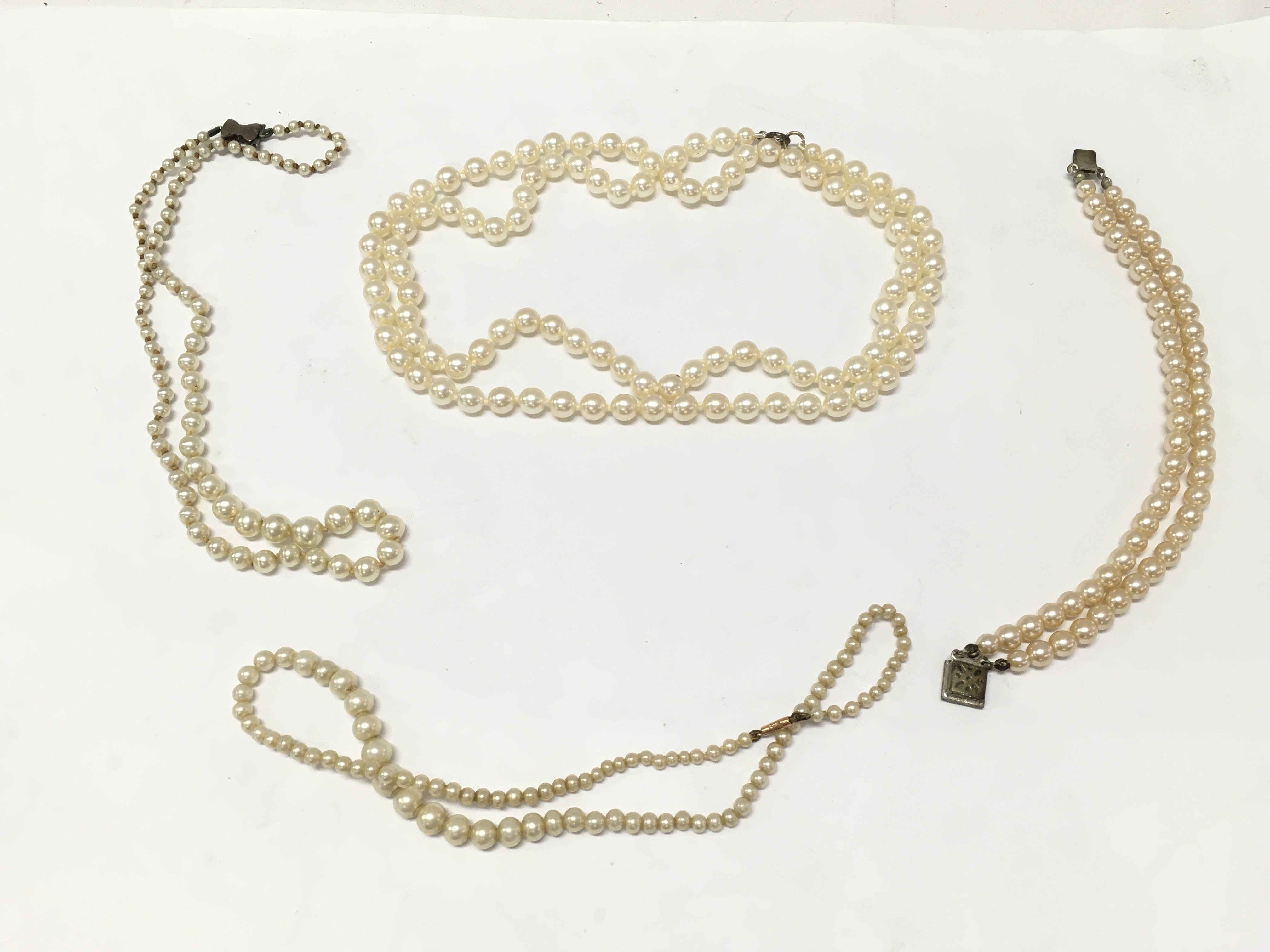 Pearl necklaces and bracelets, postage catA