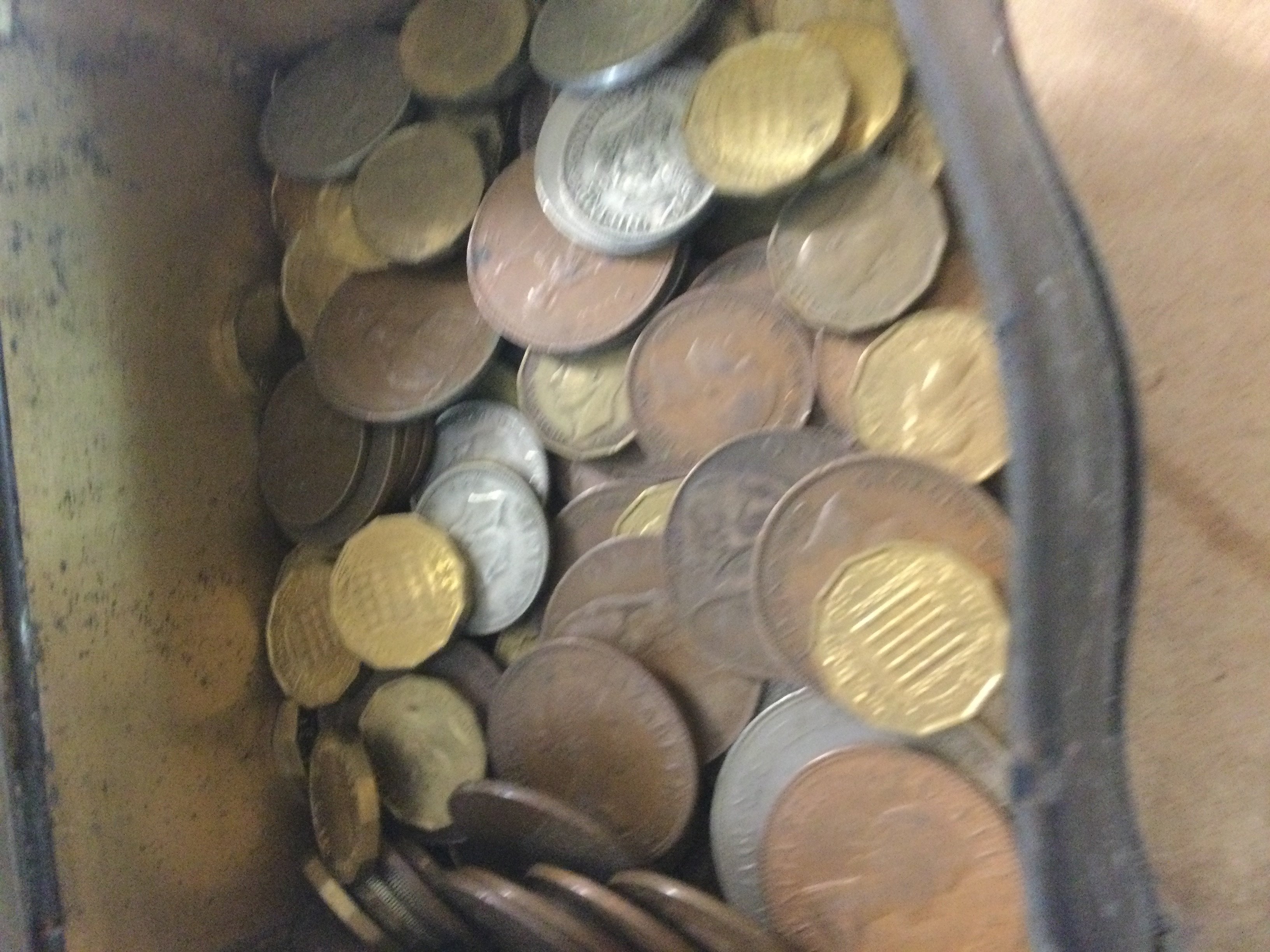 A small tin containing coinage various.