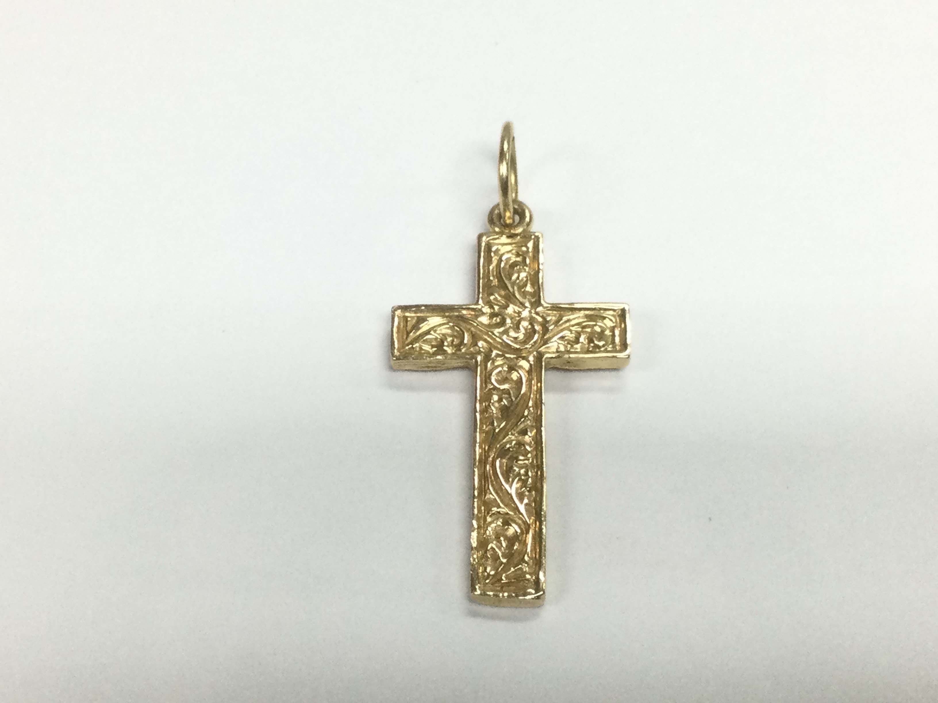 A 9ct gold cross, approx 4.25g. Shipping category A.