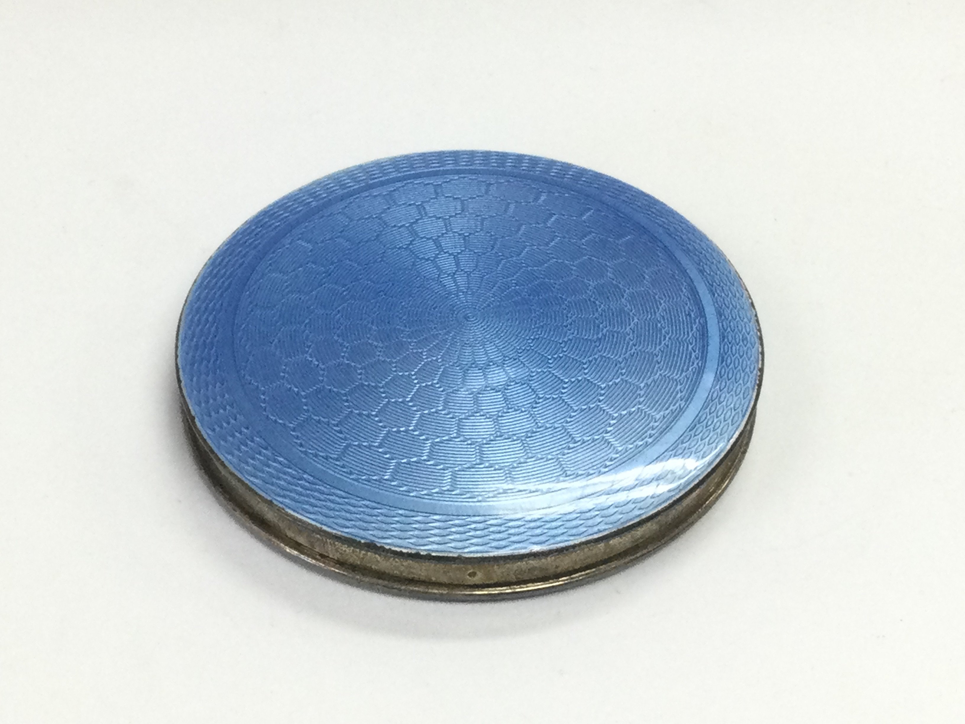 A silver and blue enamelled compact, Birmingham hallmarks. Shipping category A.