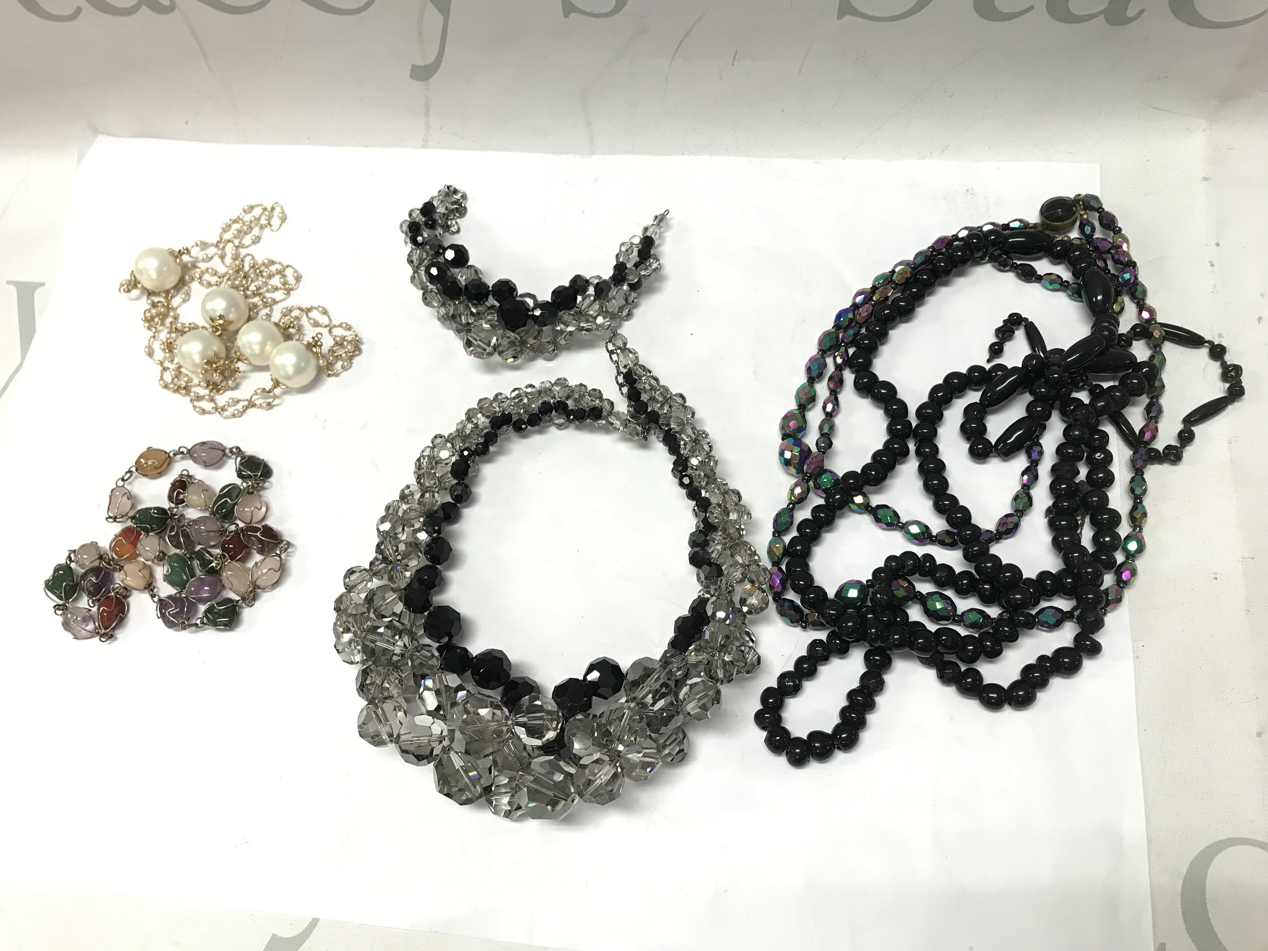 Necklaces, bracelets, postage category A