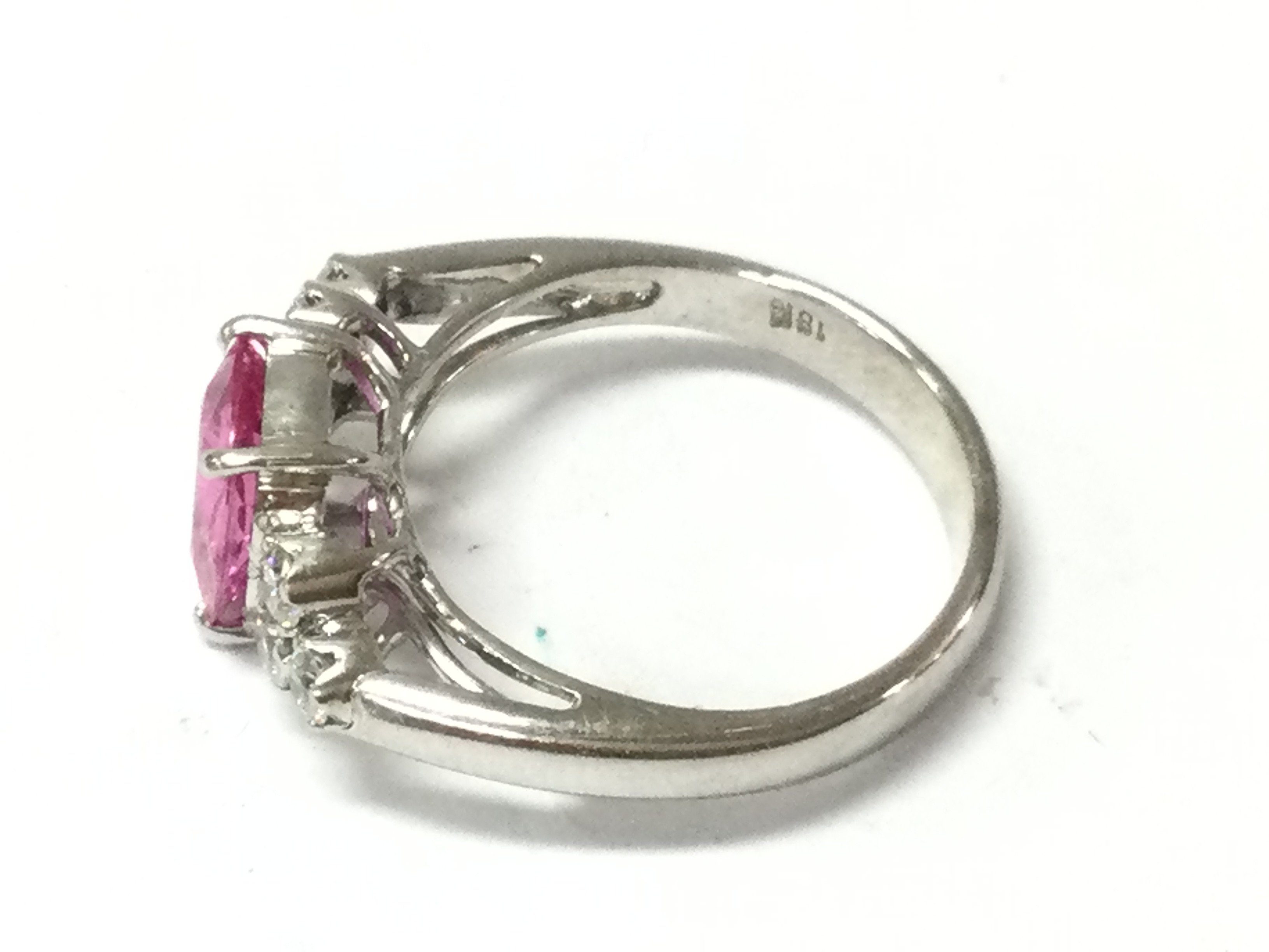 An 18ct white gold pink topaz set ring. Size N and 5.04g