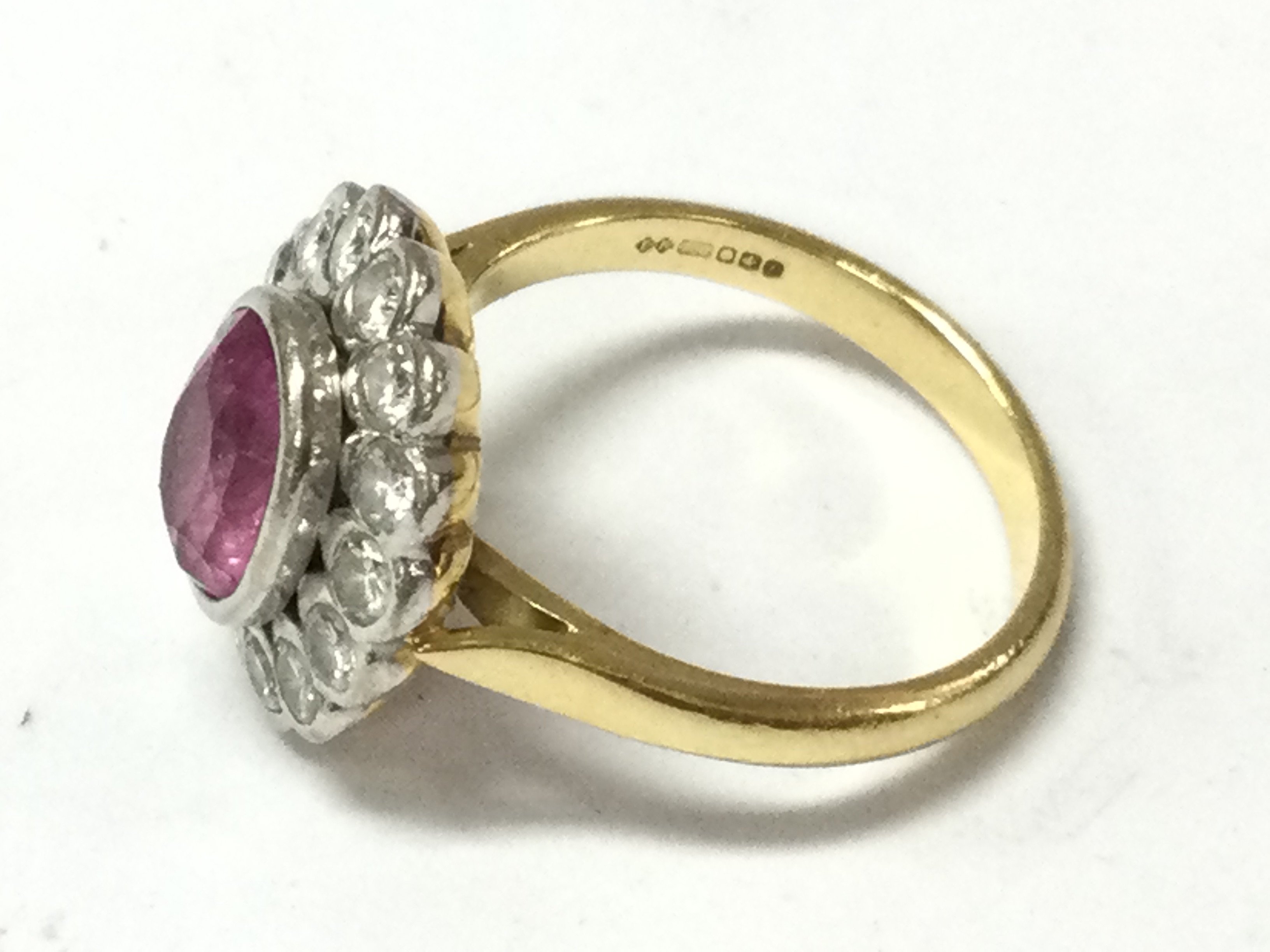 An 18ct gold ring set with pink Topaz. 6.45g and size P.